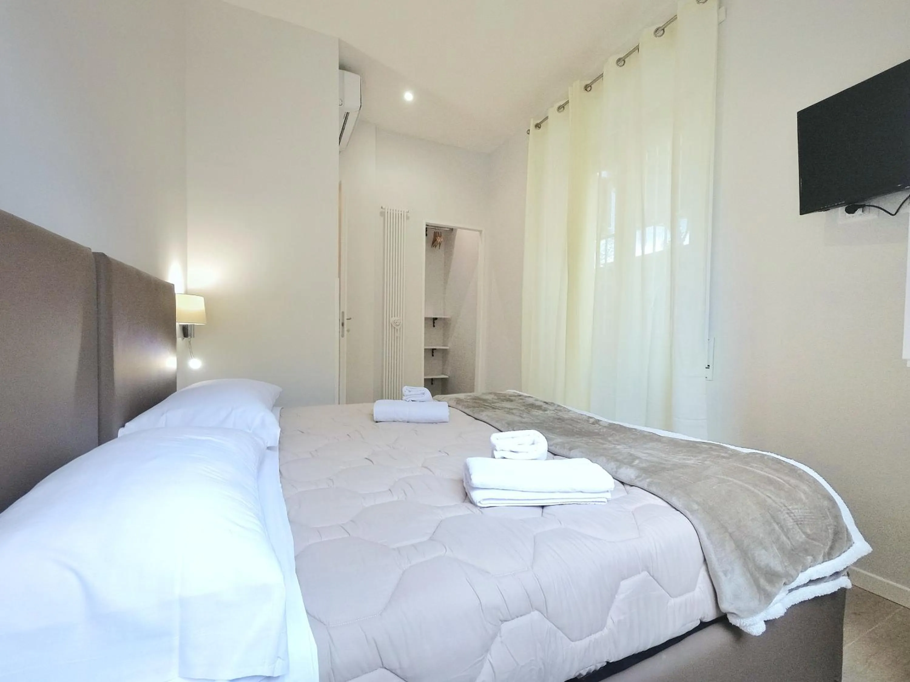 Bed in B&B Aurelia Garden Rooms