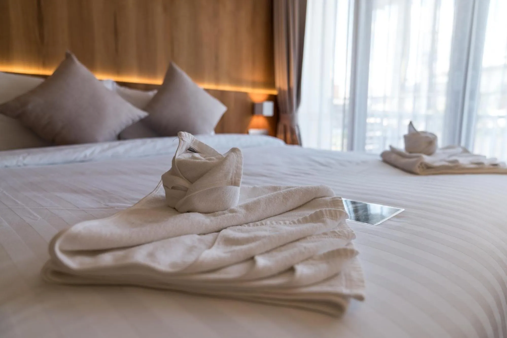 Bed in Nuan Boutique Hotel