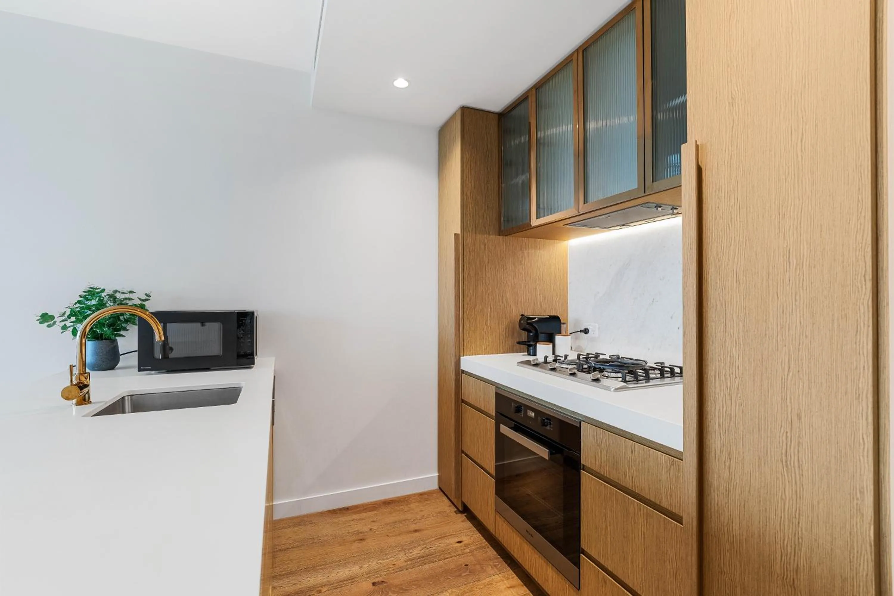 Kitchen or kitchenette in Collins House Apartments by CLLIX