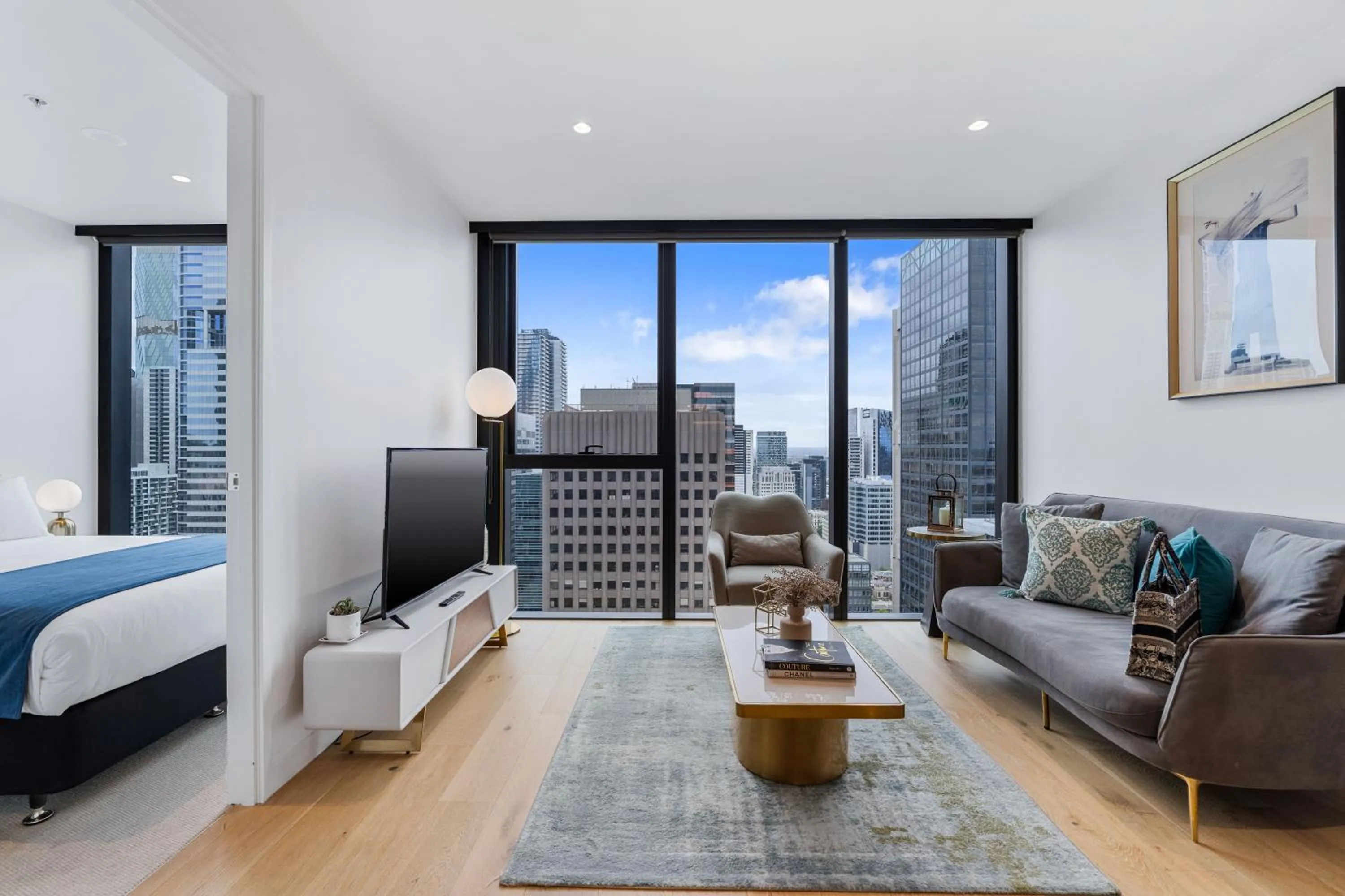 Living room, Bed in Collins House Apartments by CLLIX