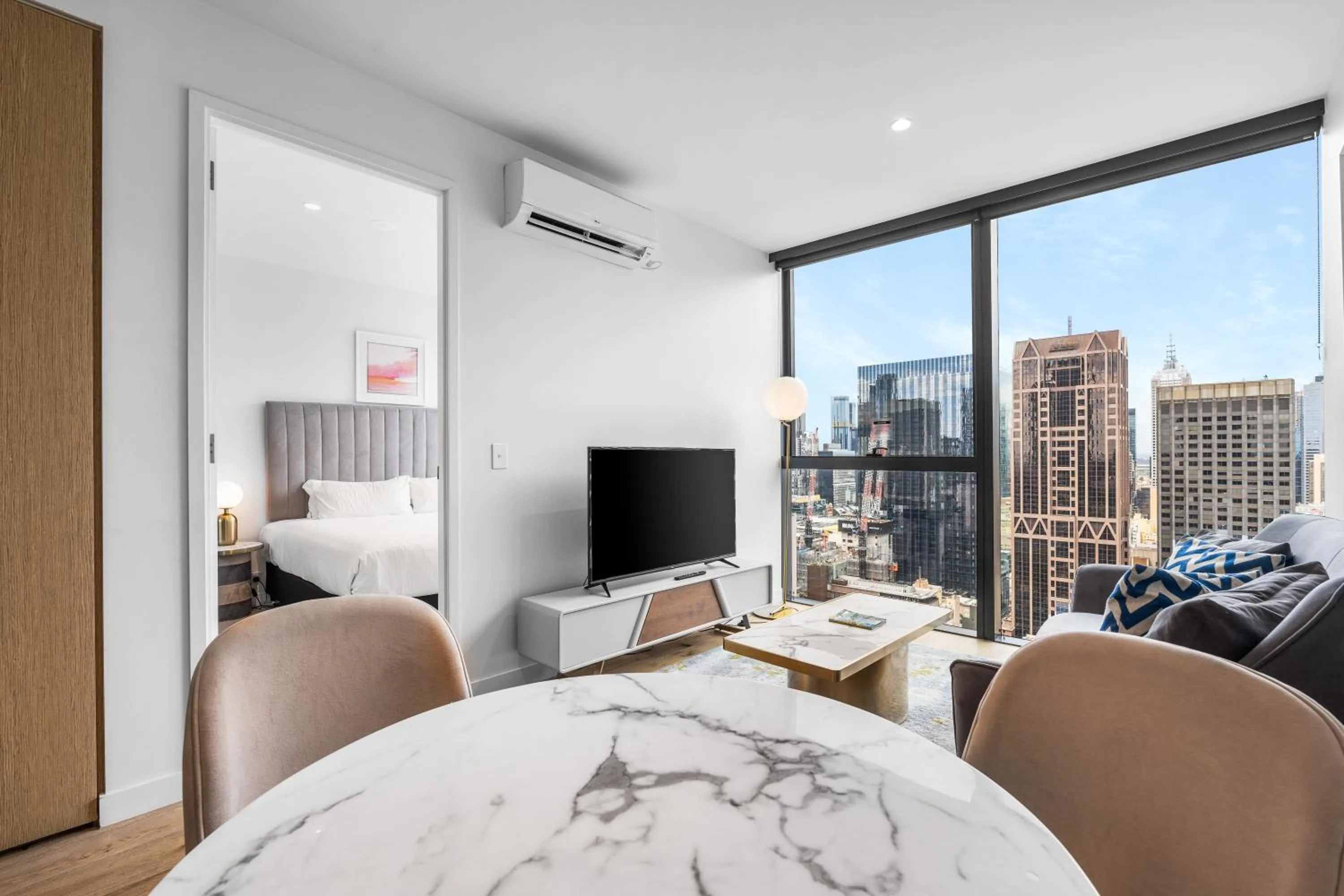 Living room, Bed in Collins House Apartments by CLLIX