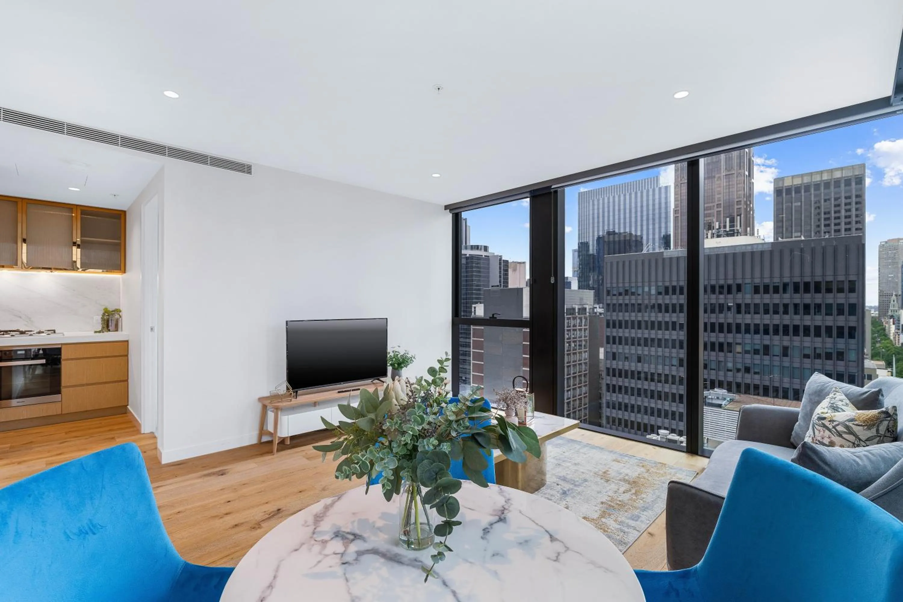 Living room in Collins House Apartments by CLLIX