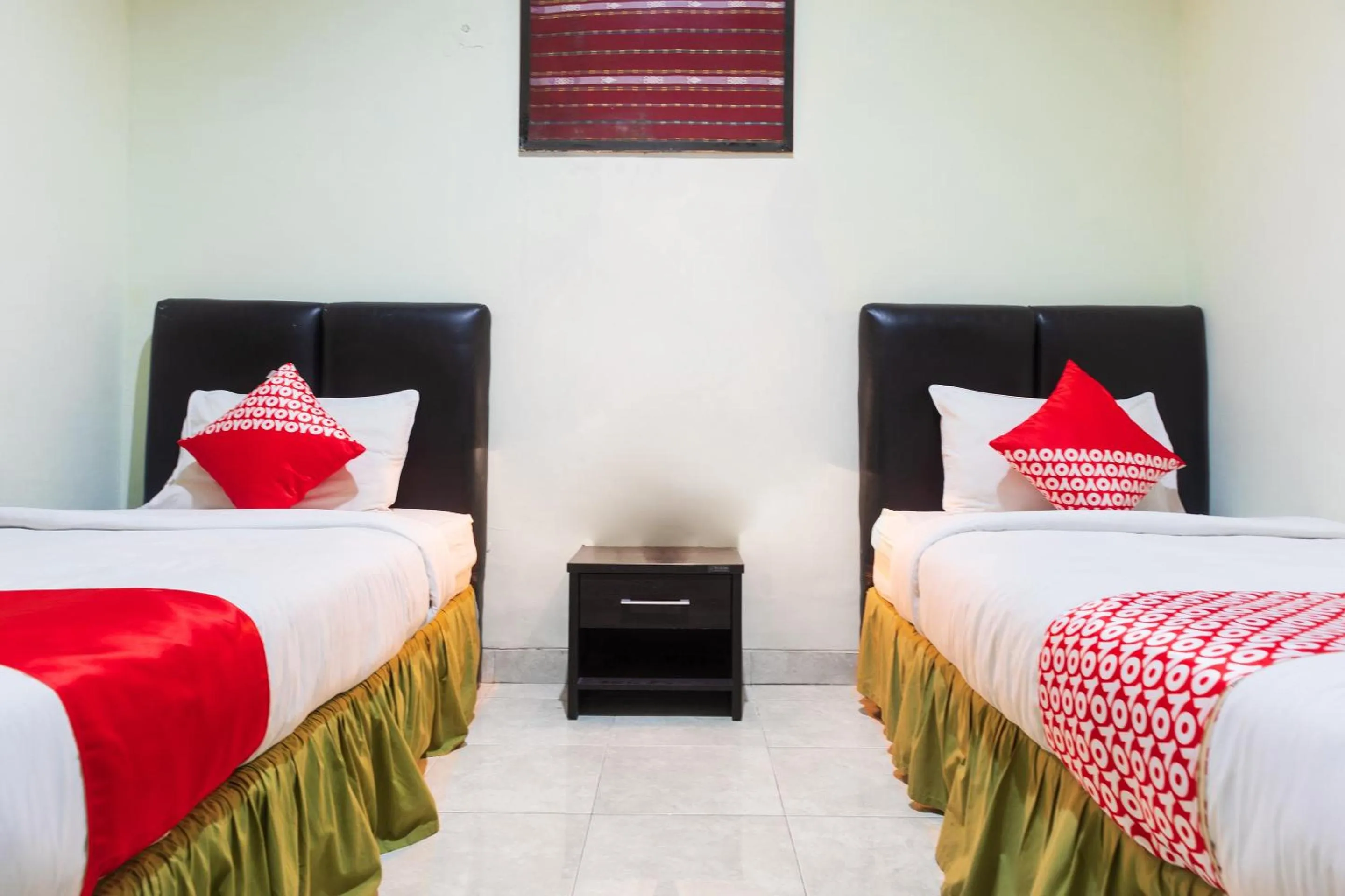 Bedroom in Super OYO 1682 Greenia Hotel