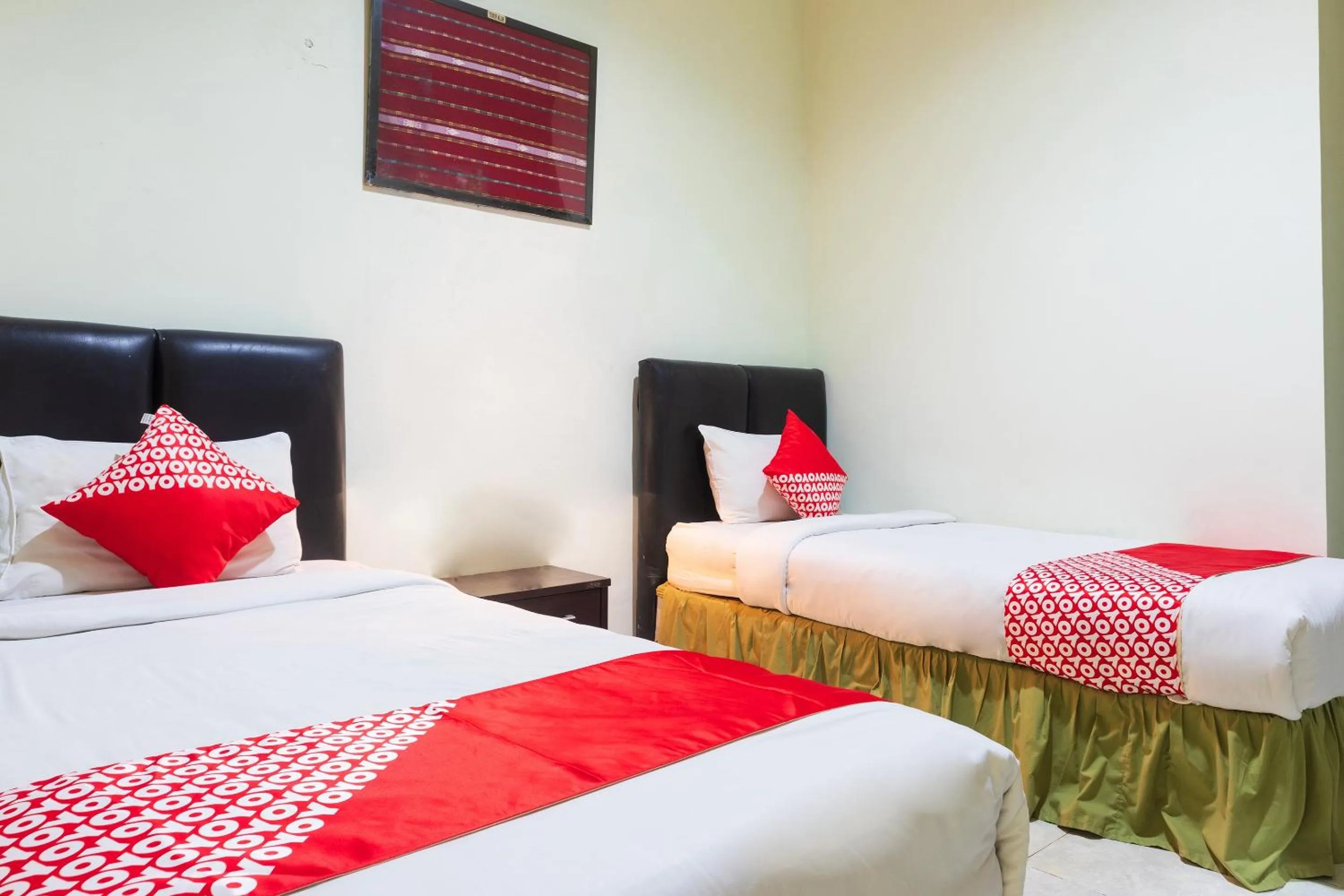 Bedroom in Super OYO 1682 Greenia Hotel