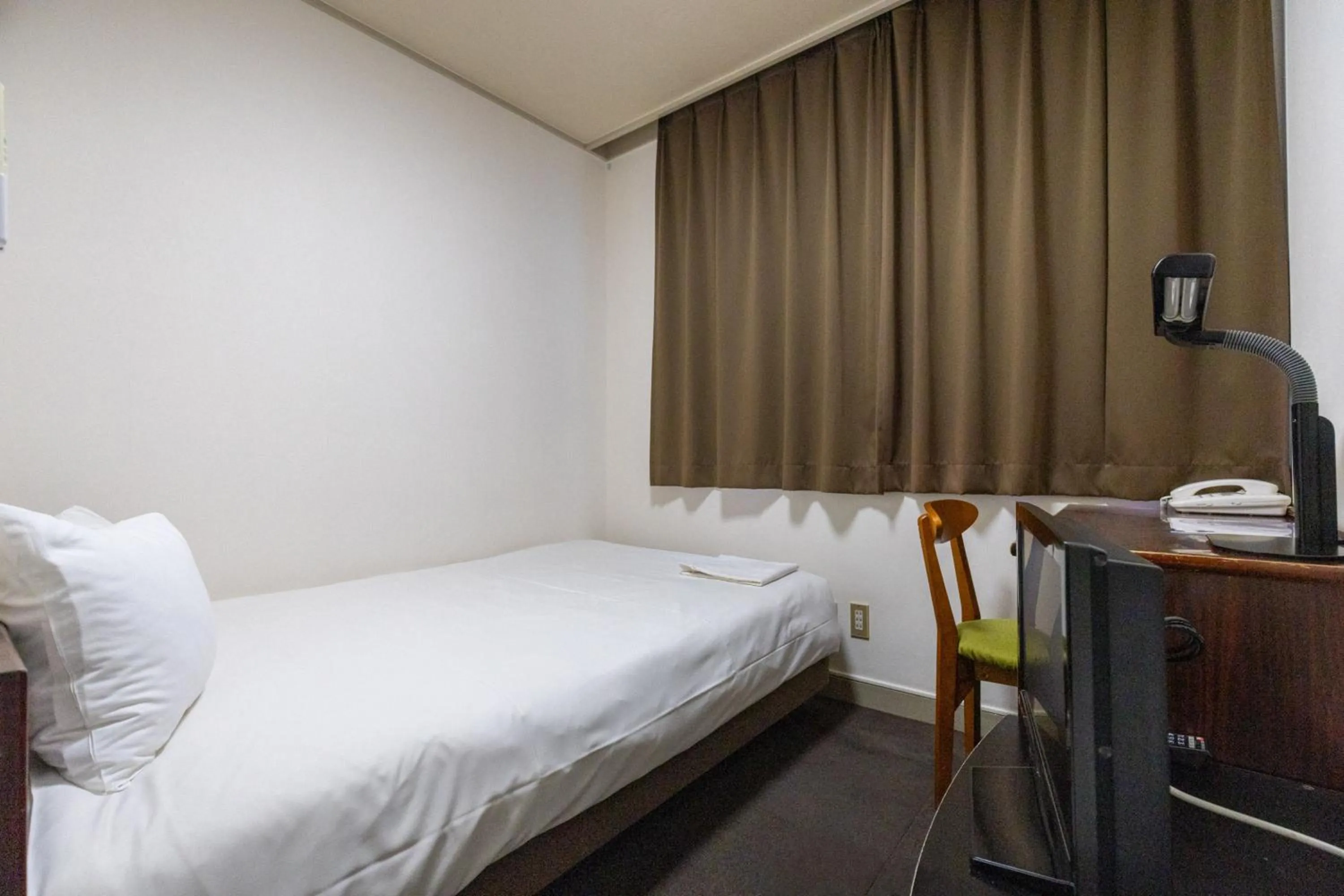 Photo of the whole room, Bed in Tabist Business Hotel Suehiro Matsuyama