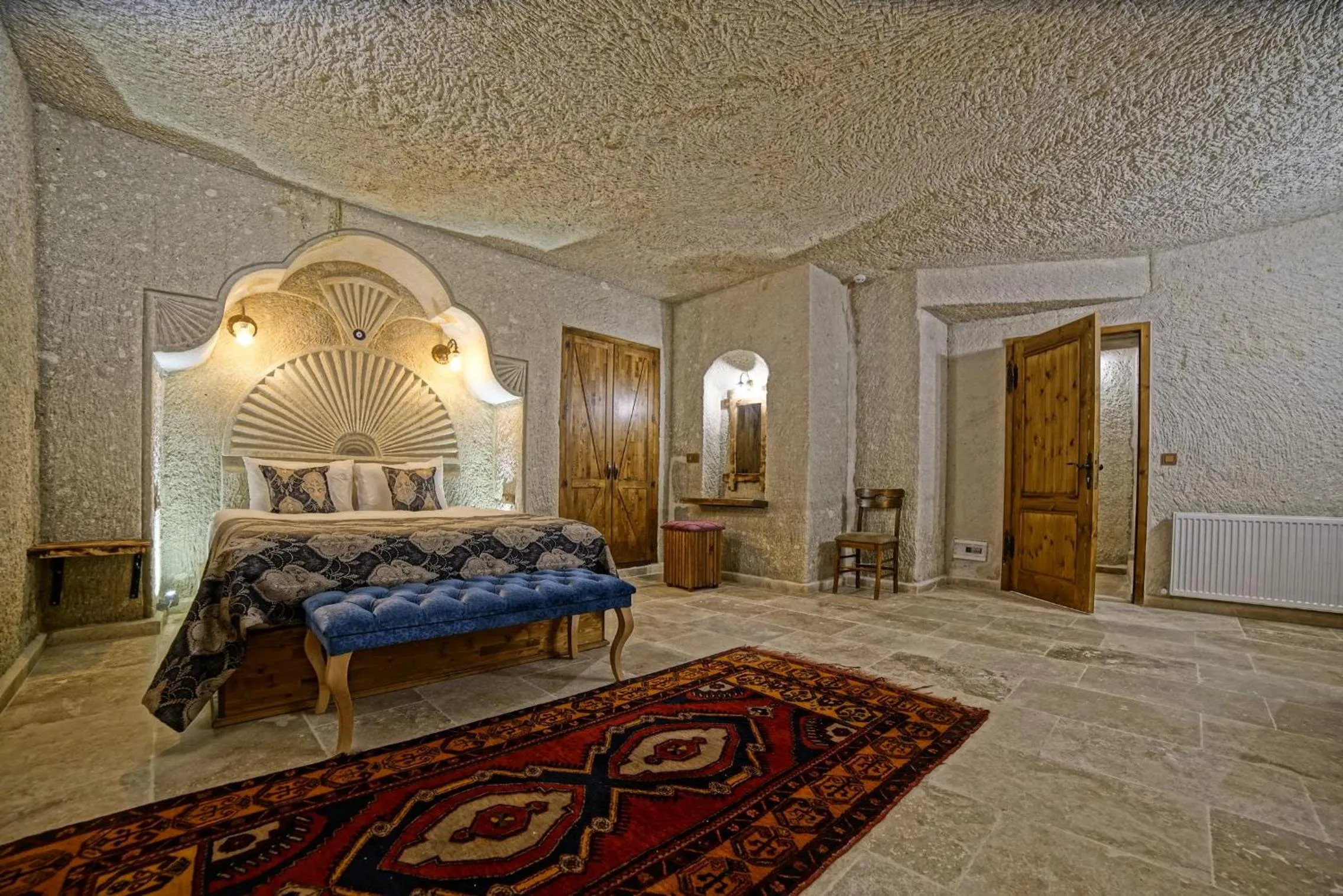 Bed in Risus Cave Suites