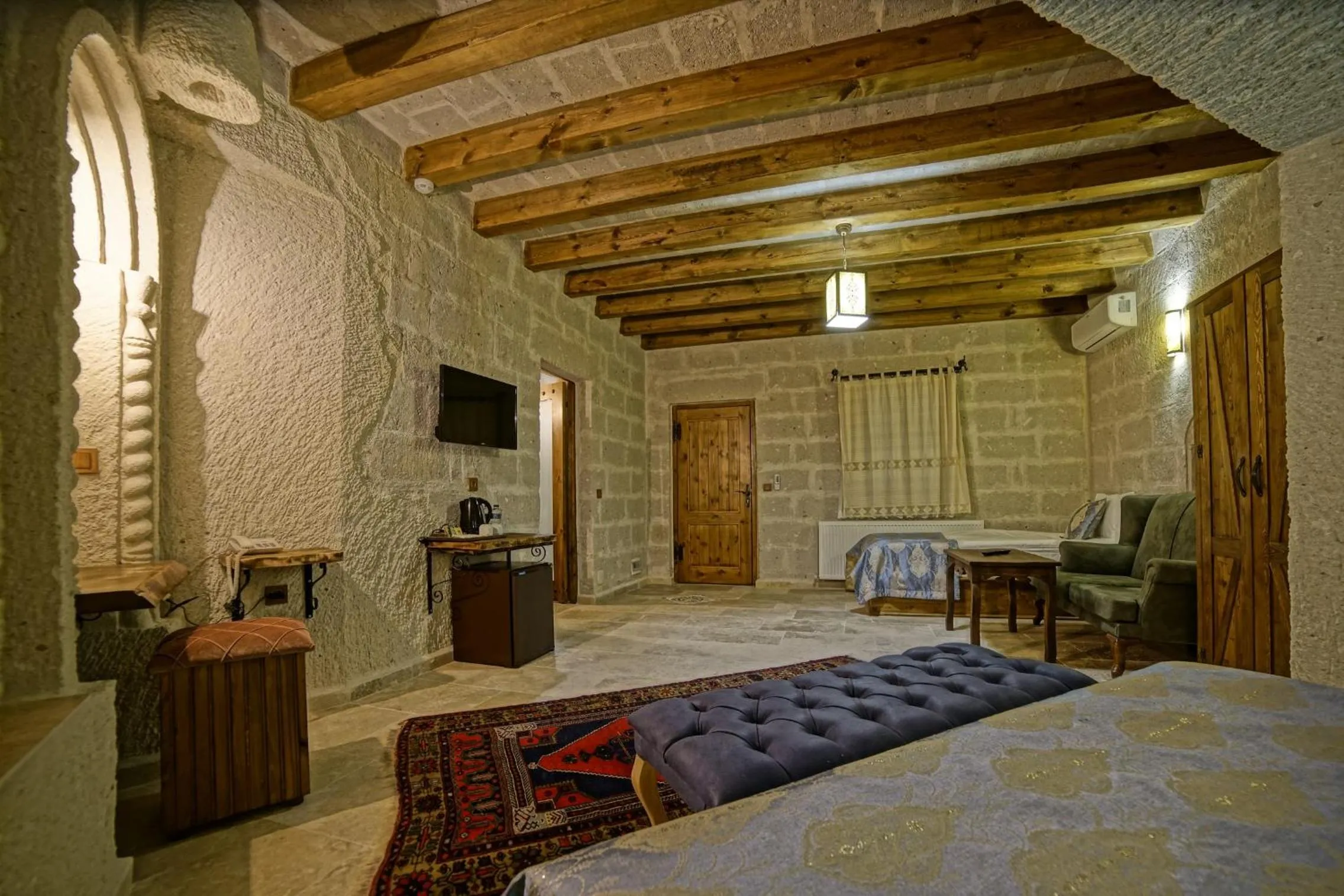 Bed in Risus Cave Suites