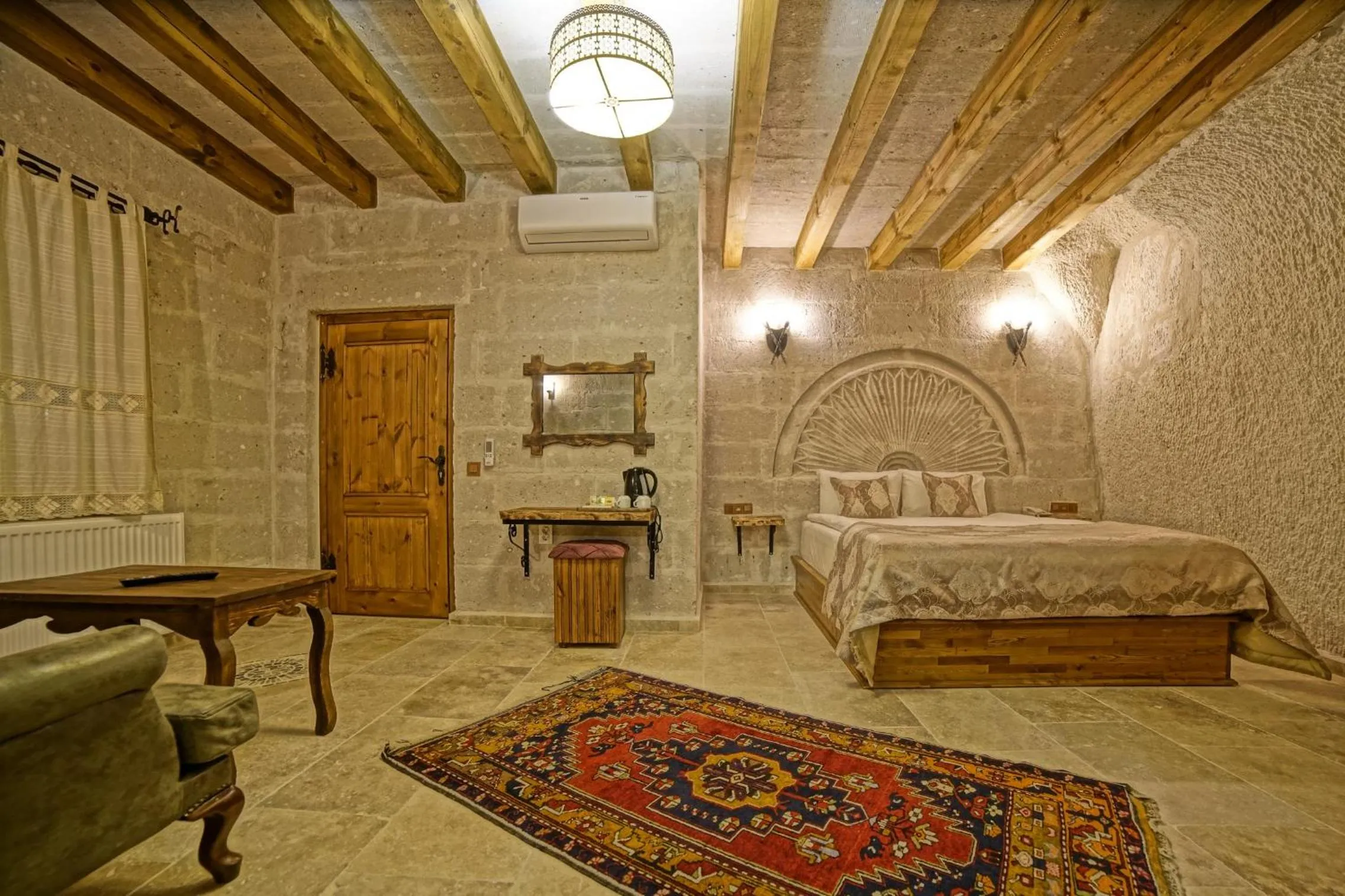 Bed in Risus Cave Suites