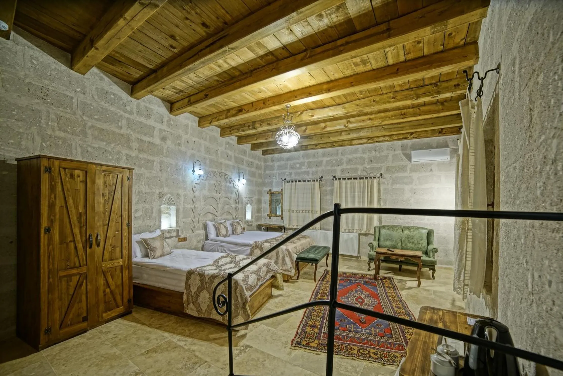 Bed in Risus Cave Suites