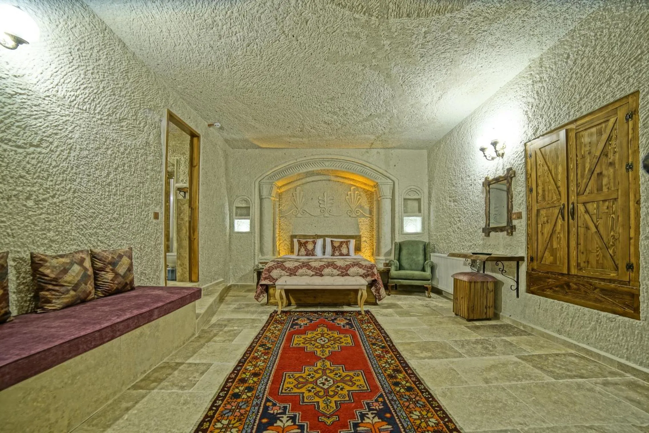 Bed in Risus Cave Suites