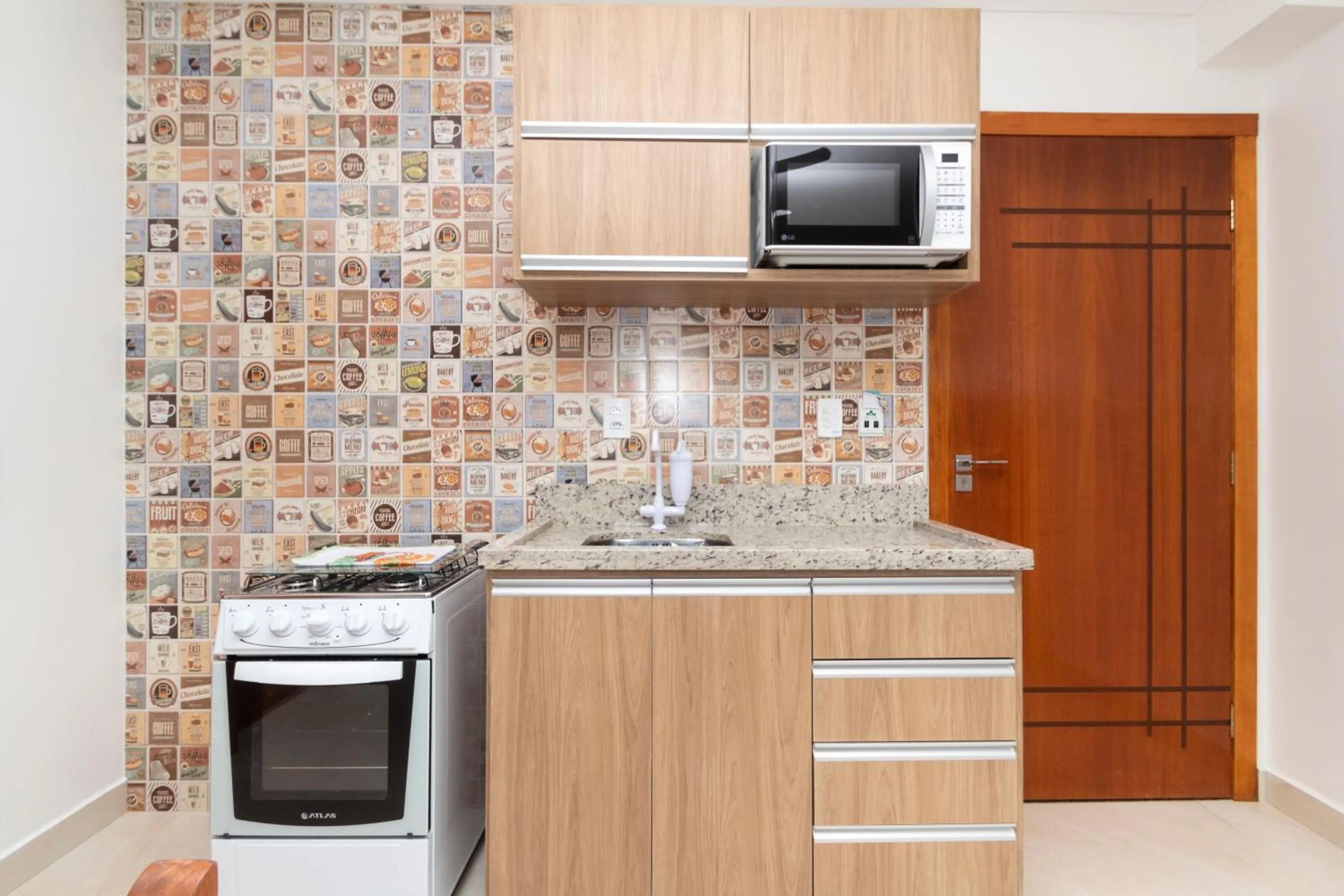 Communal kitchen in Apart Hotel Canto Grande