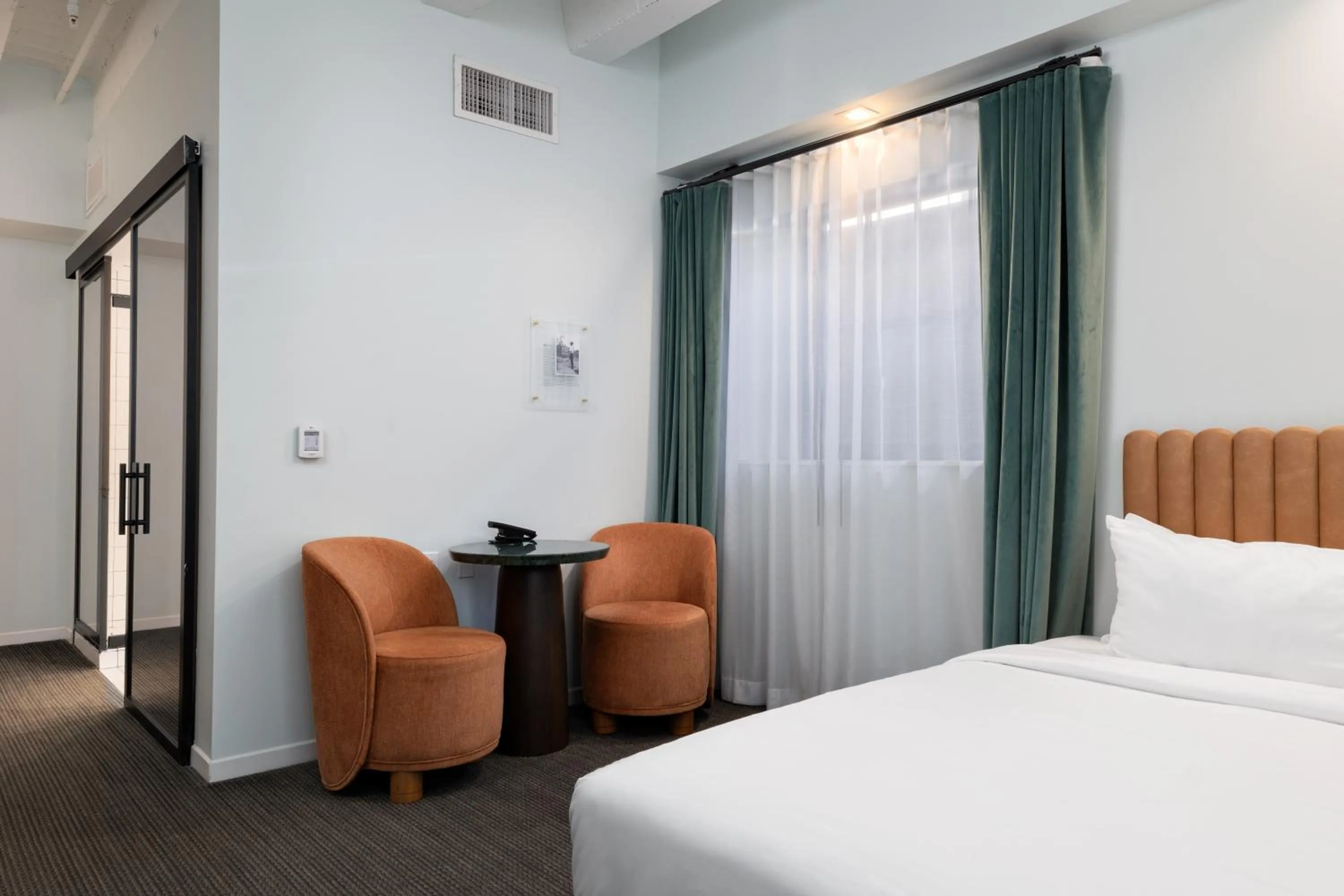 Bed in The Guild Hotel, San Diego Downtown, a Marriott Tribute Portfolio Hotel