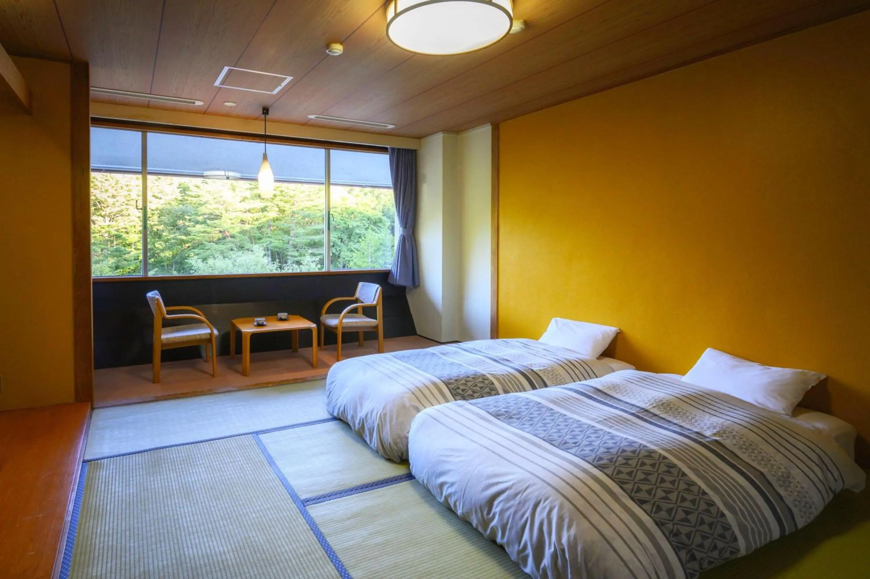 Bed in Takamiya Hotel Bonari no Mori