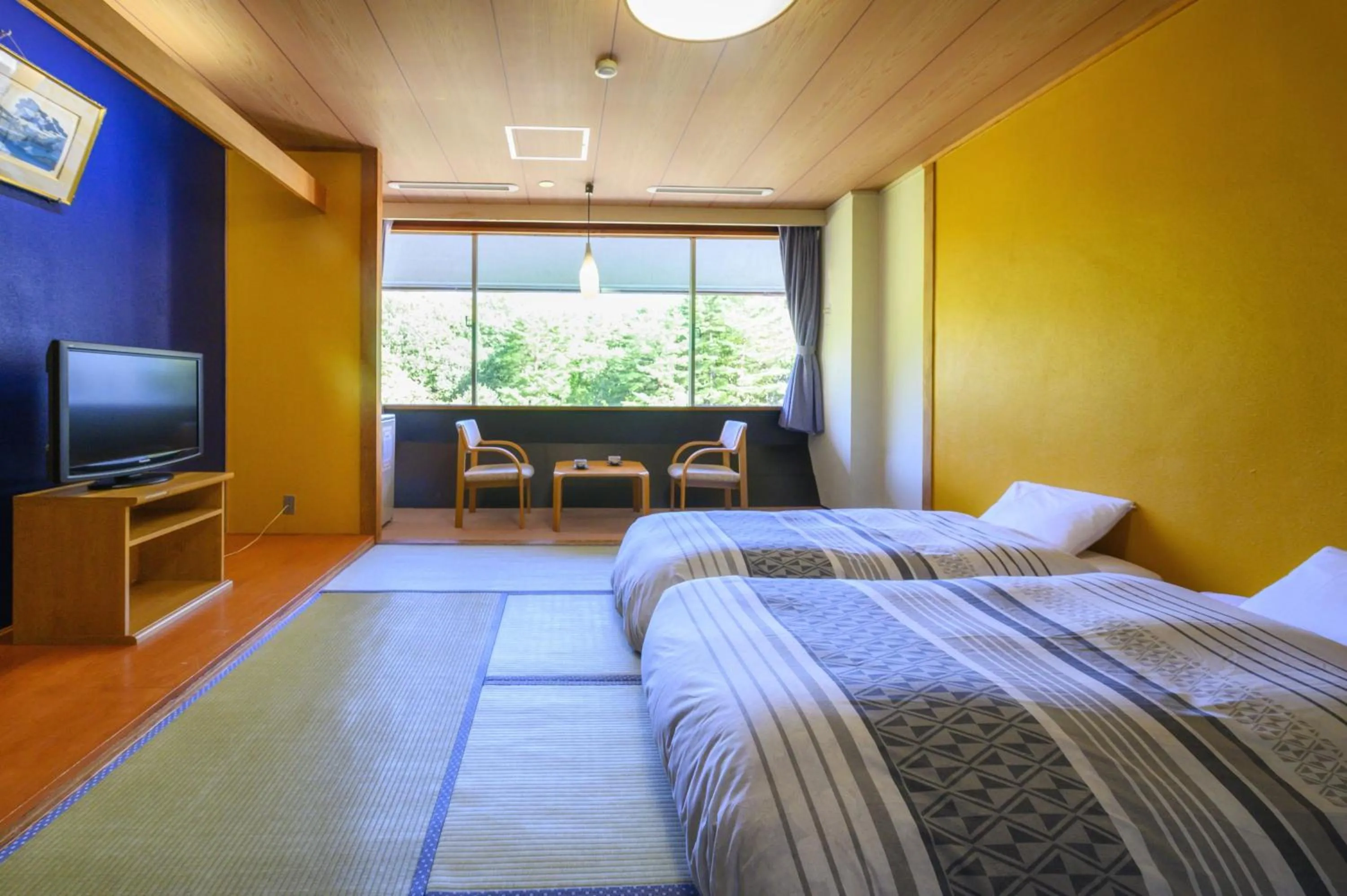 Bed in Takamiya Hotel Bonari no Mori