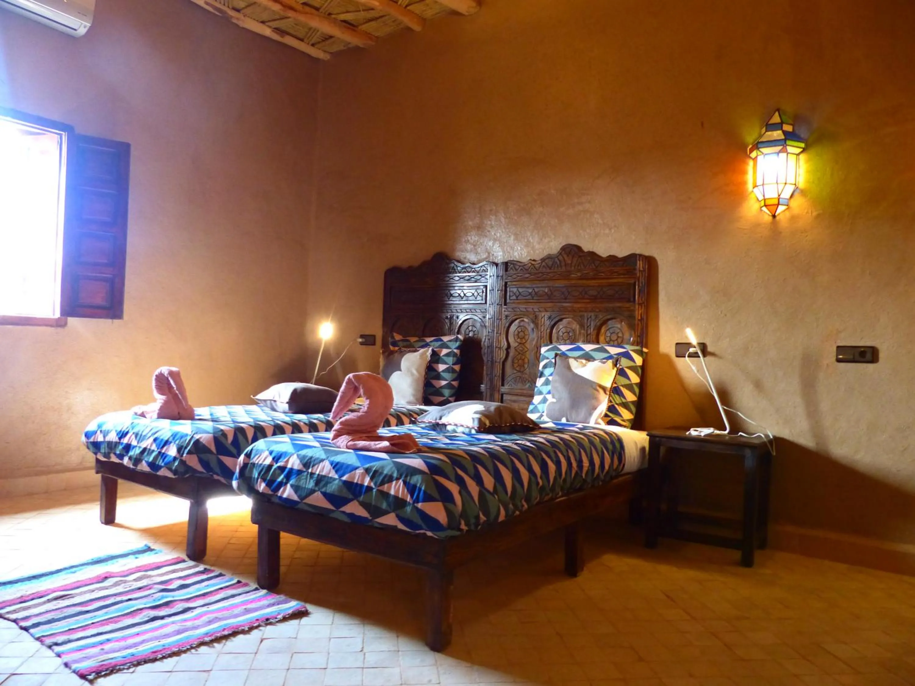 Bed in Riad Caravasar