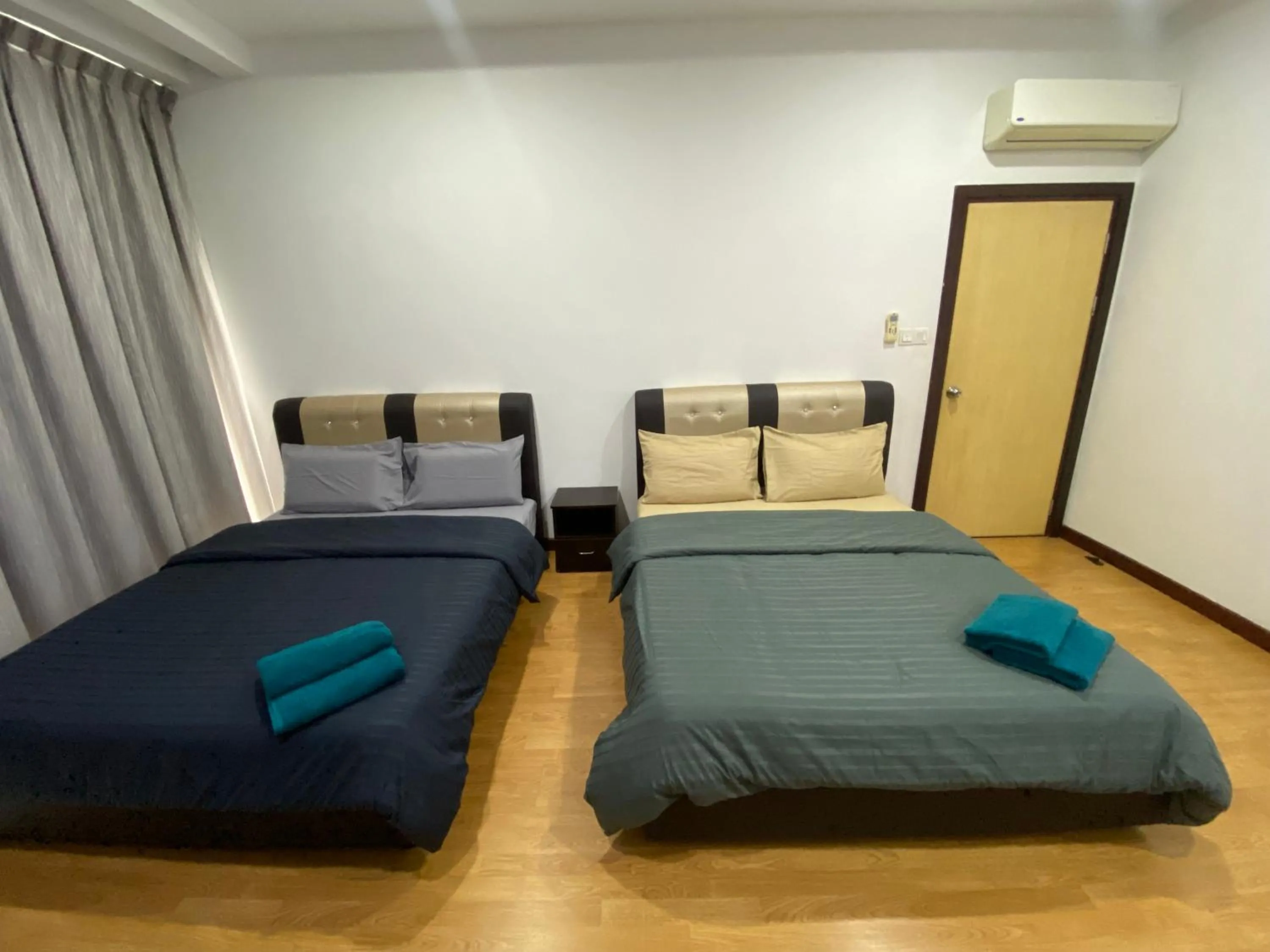 Bed in Imperial Suites at Boulevard Mall