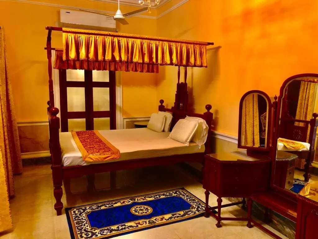 Bed in COSSIMBAZAR PALACE OF THE ROYS ( RAJBARI)