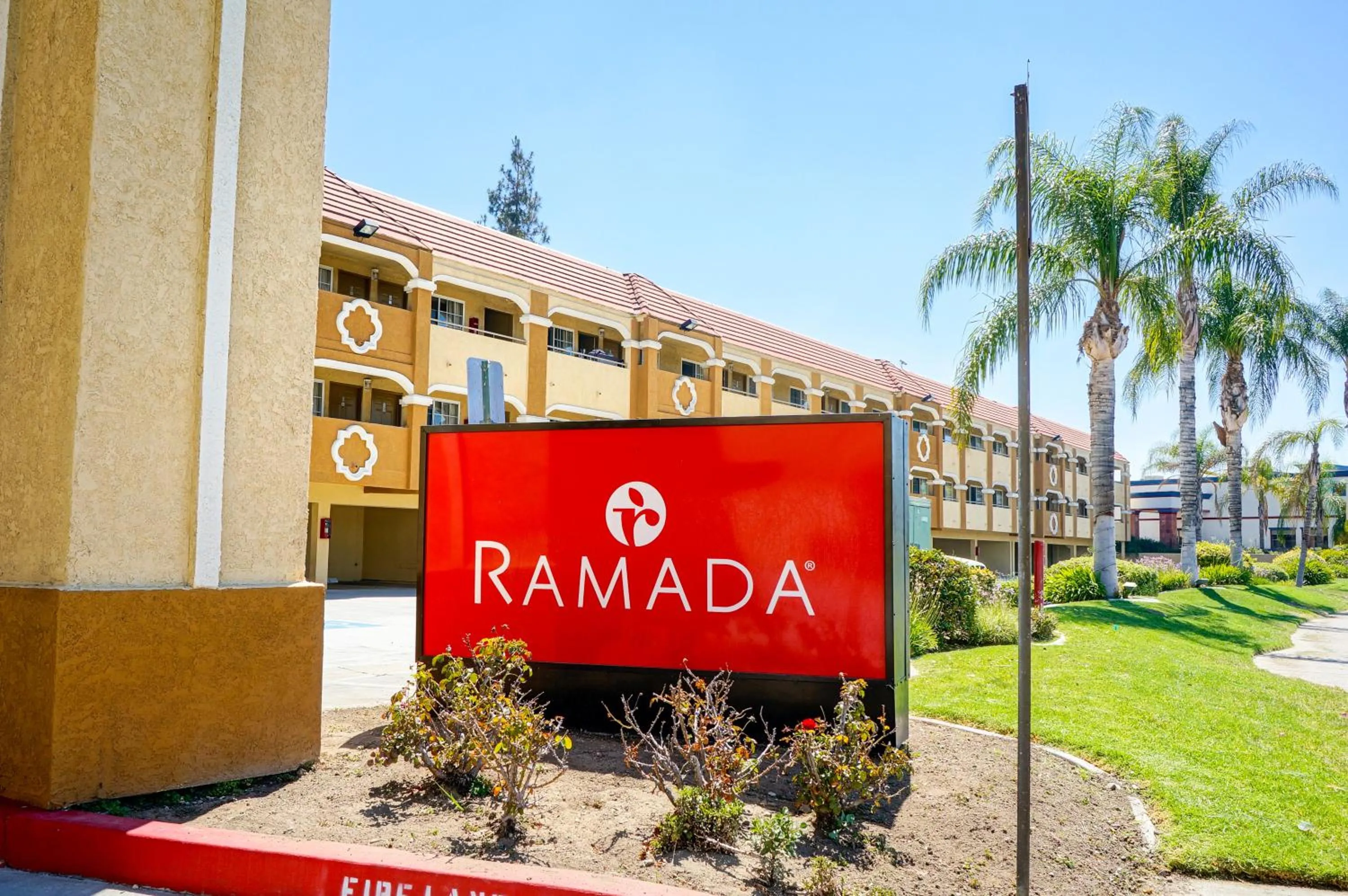 Property logo or sign in Ramada by Wyndham Ontario Airport & Convention Center