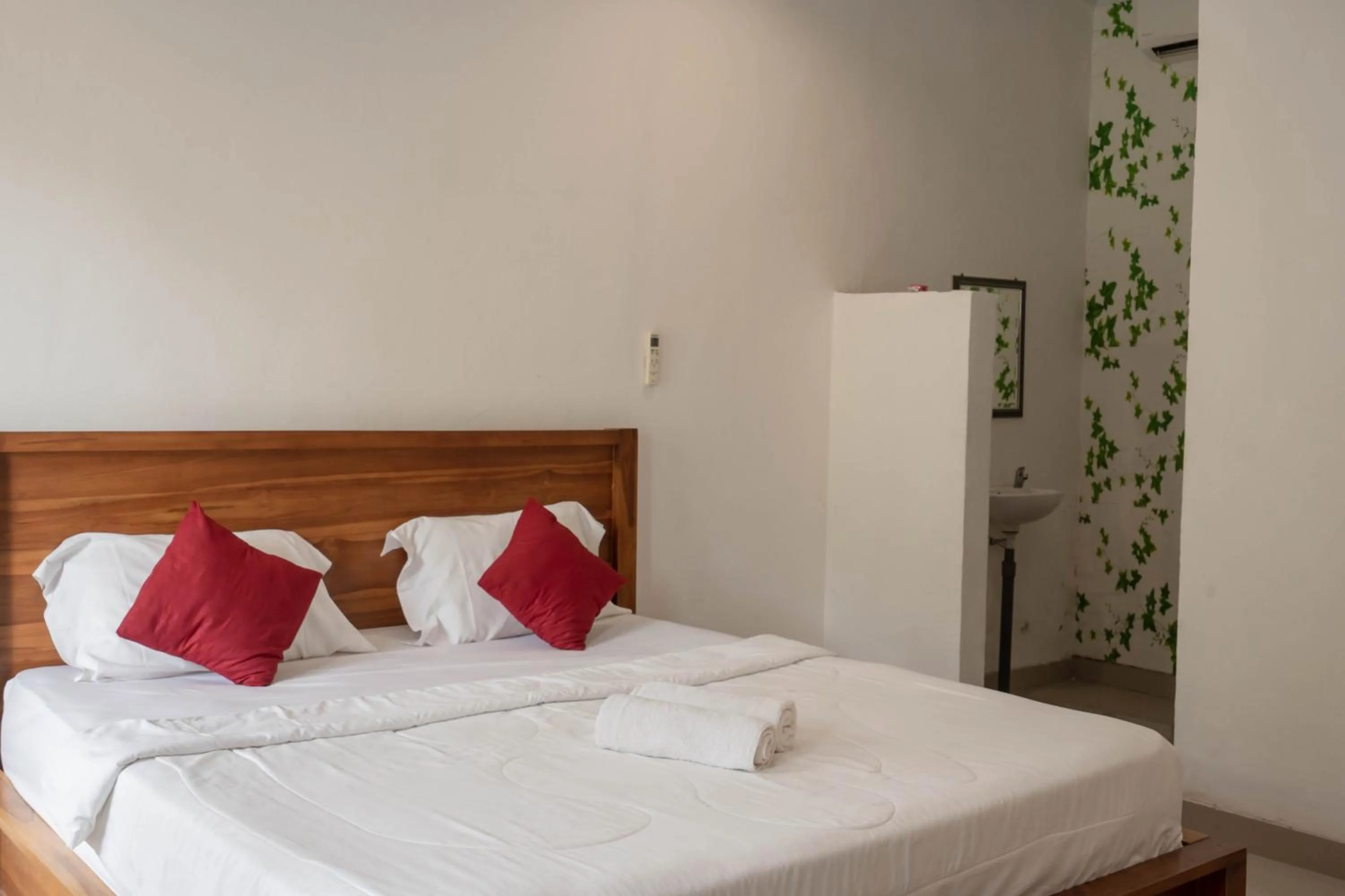 Bed in Omah Nusa Guesthouse RedPartner