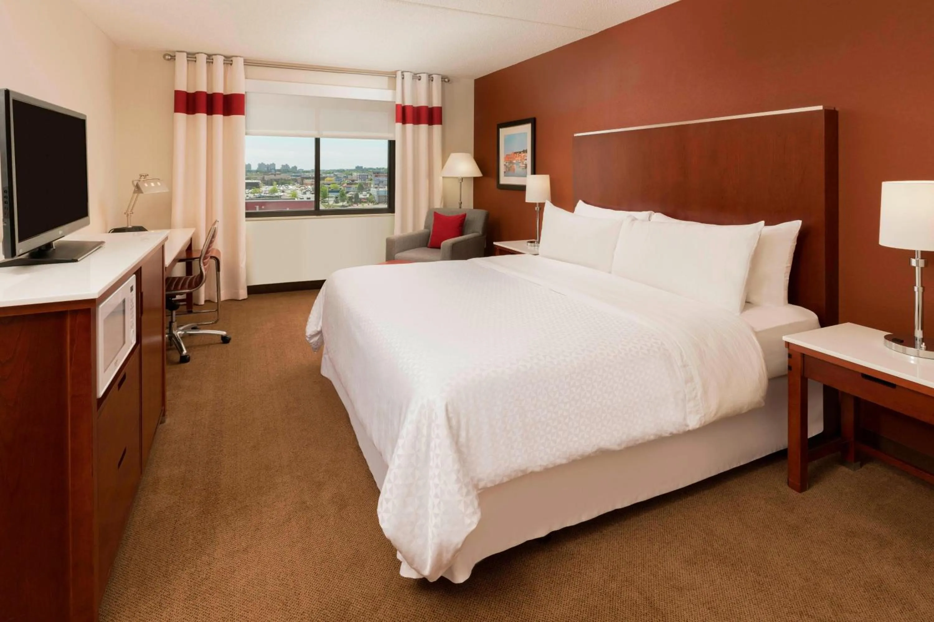 Photo of the whole room, Bed in Four Points by Sheraton Boston Logan Airport Revere