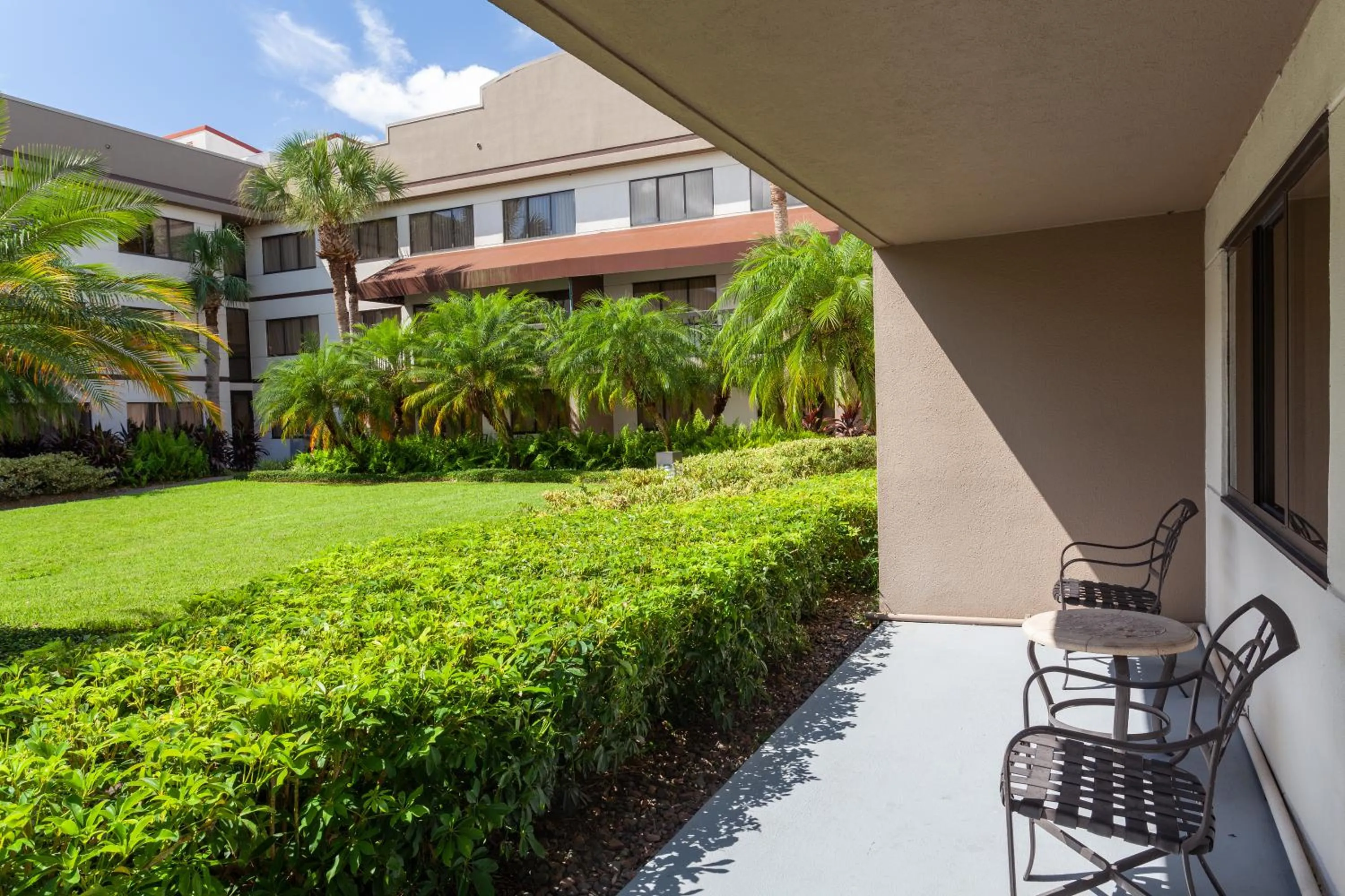 One-Bedroom Suite with Patio and Pool View in Sheraton Suites Orlando Airport Hotel