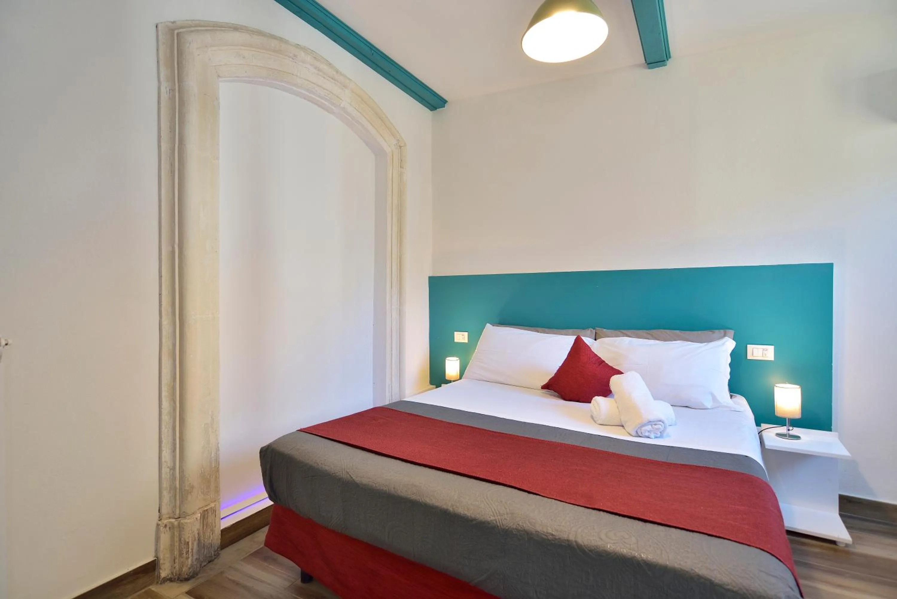 Decorative detail, Bed in Modica Old Town Rooms