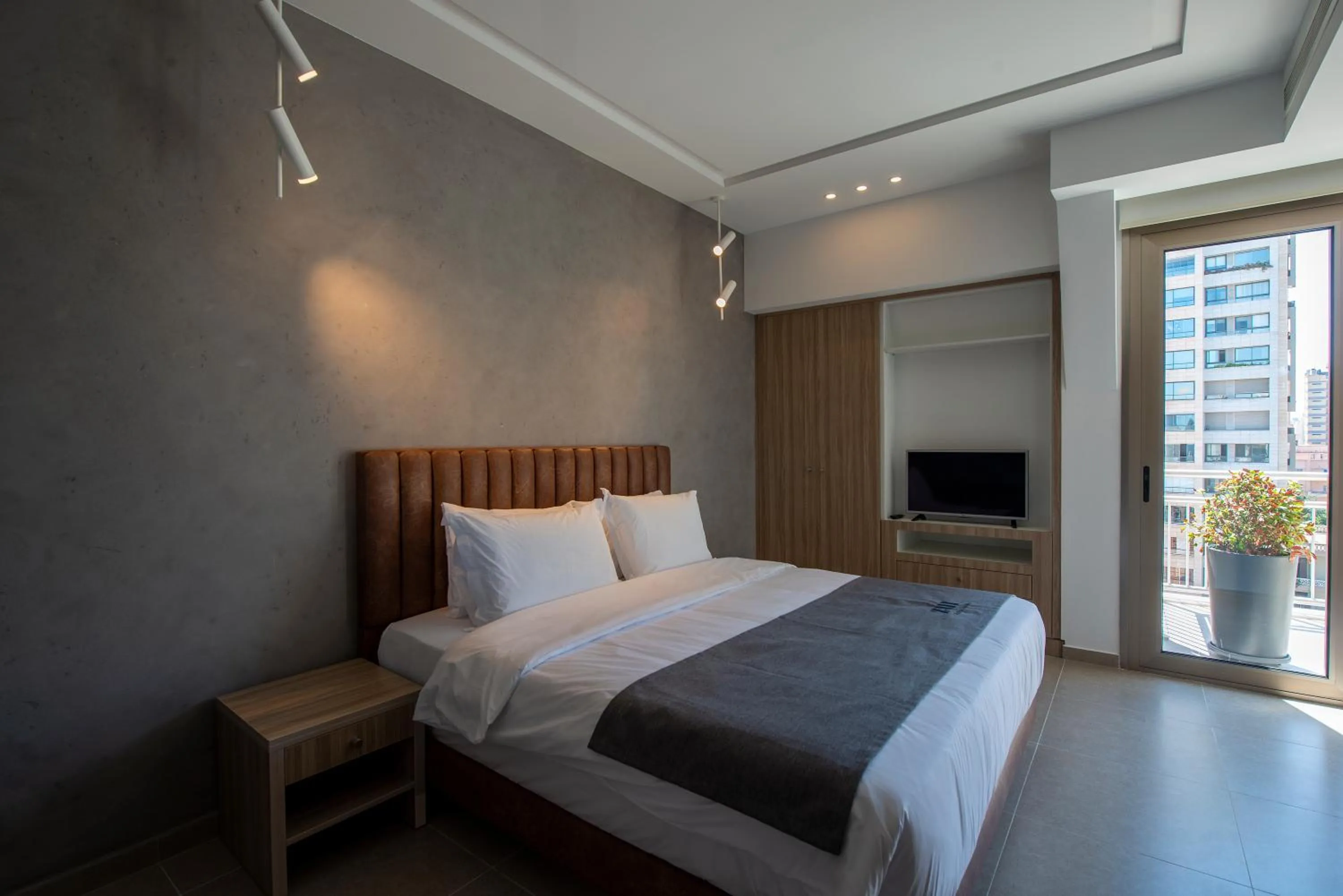 Bed in ZUR Studios and Suites