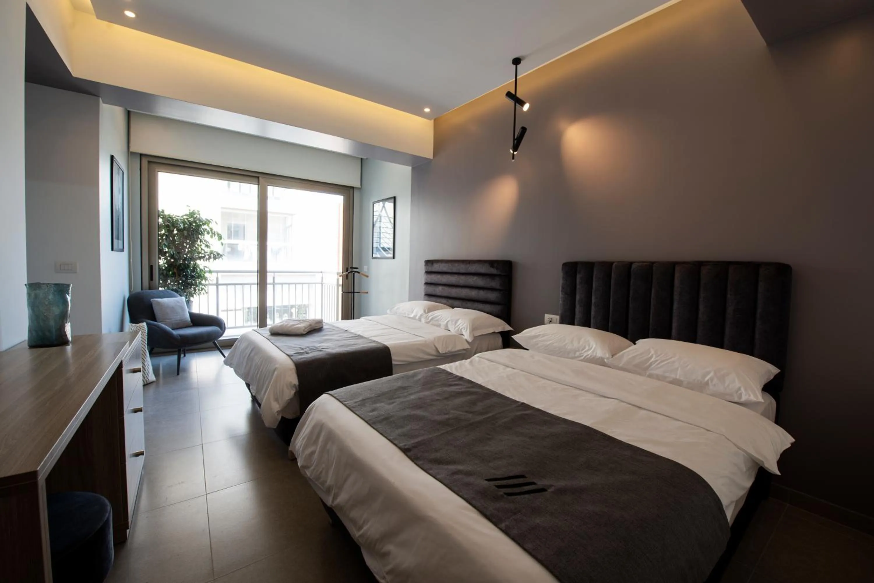 Bed in ZUR Studios and Suites