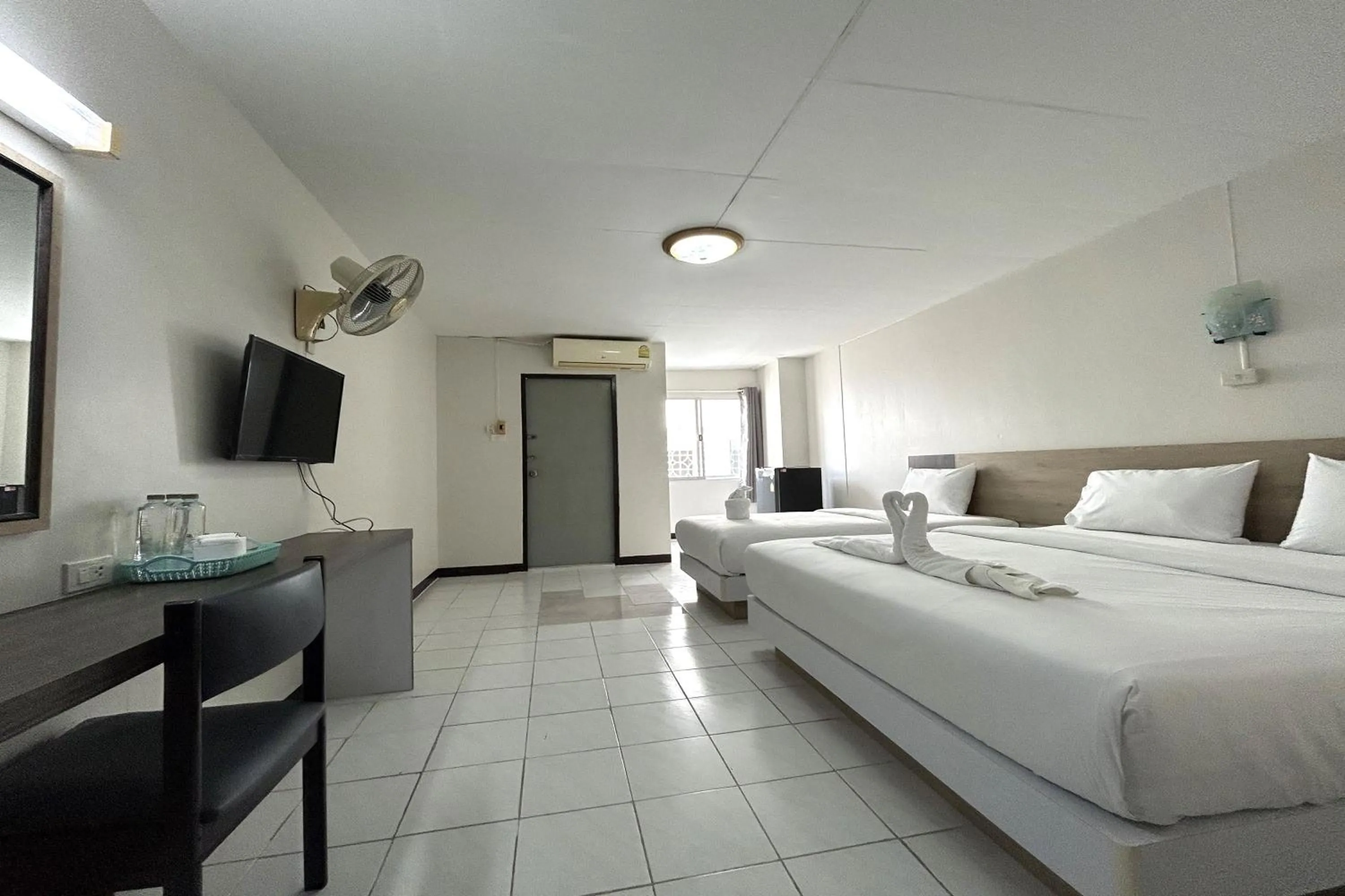 Bed in Boonchai Mansion