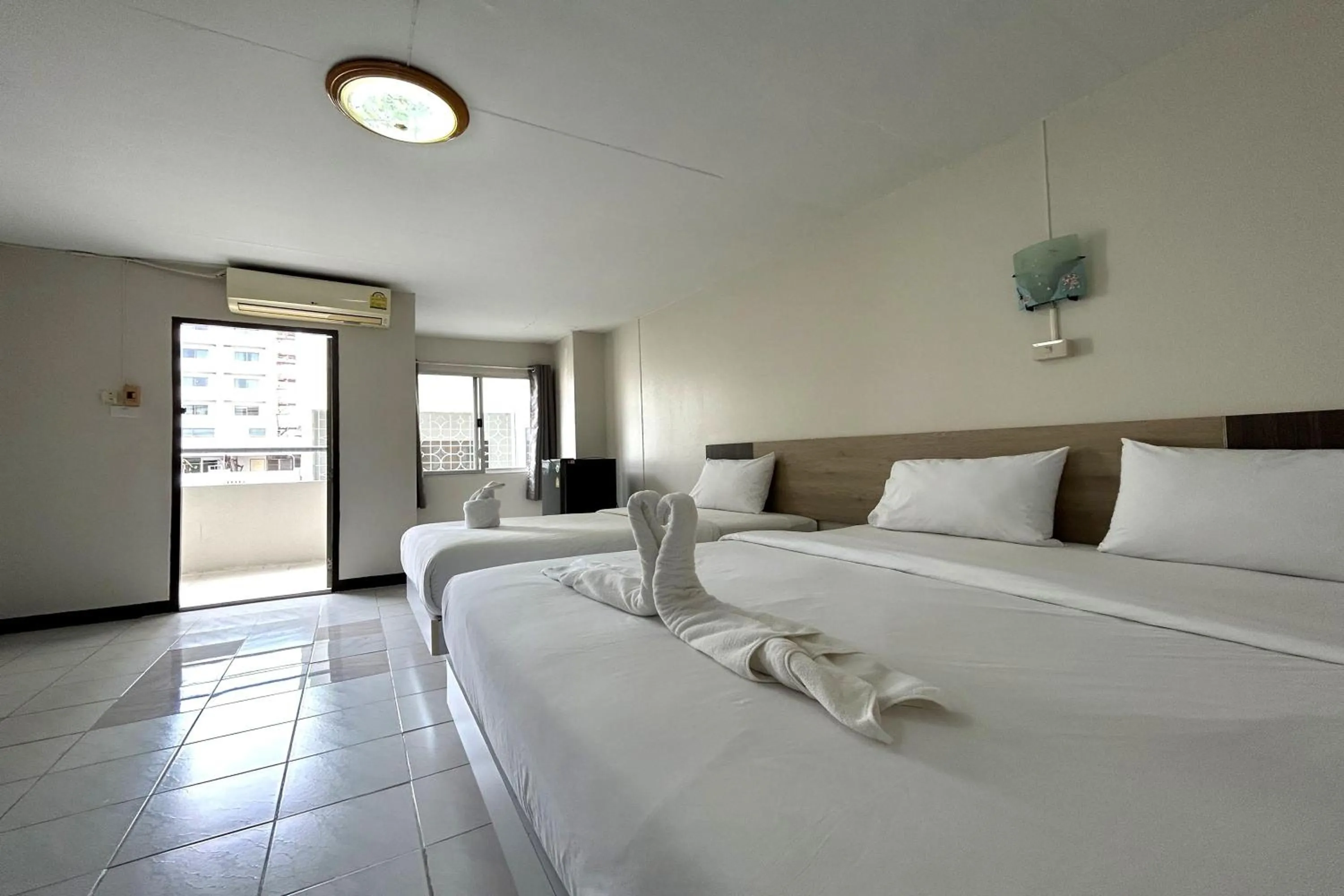 Bed in Boonchai Mansion