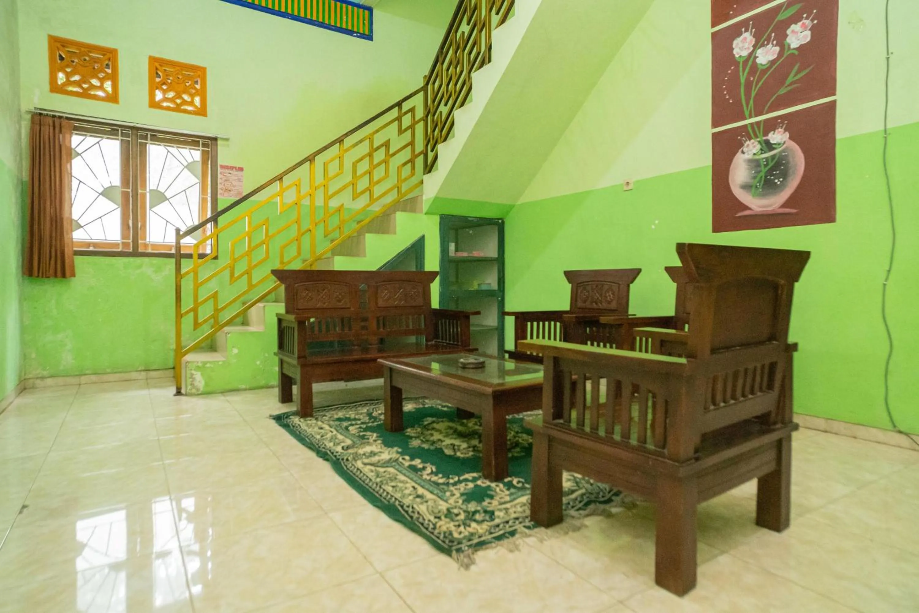 Seating area in RedDoorz Syariah near Batu Night Spectacular 3