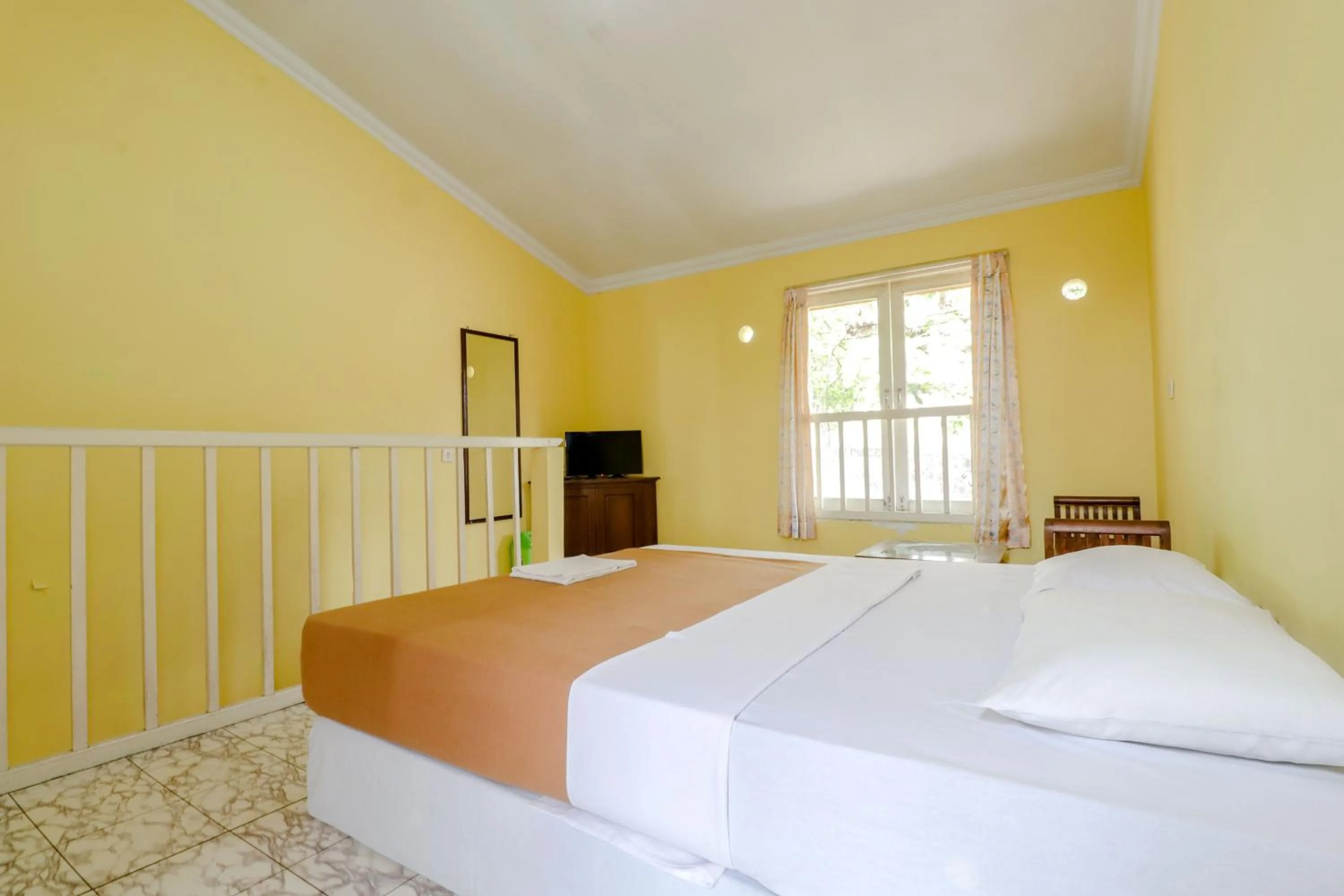 Bed in Hotel Kayu Manis