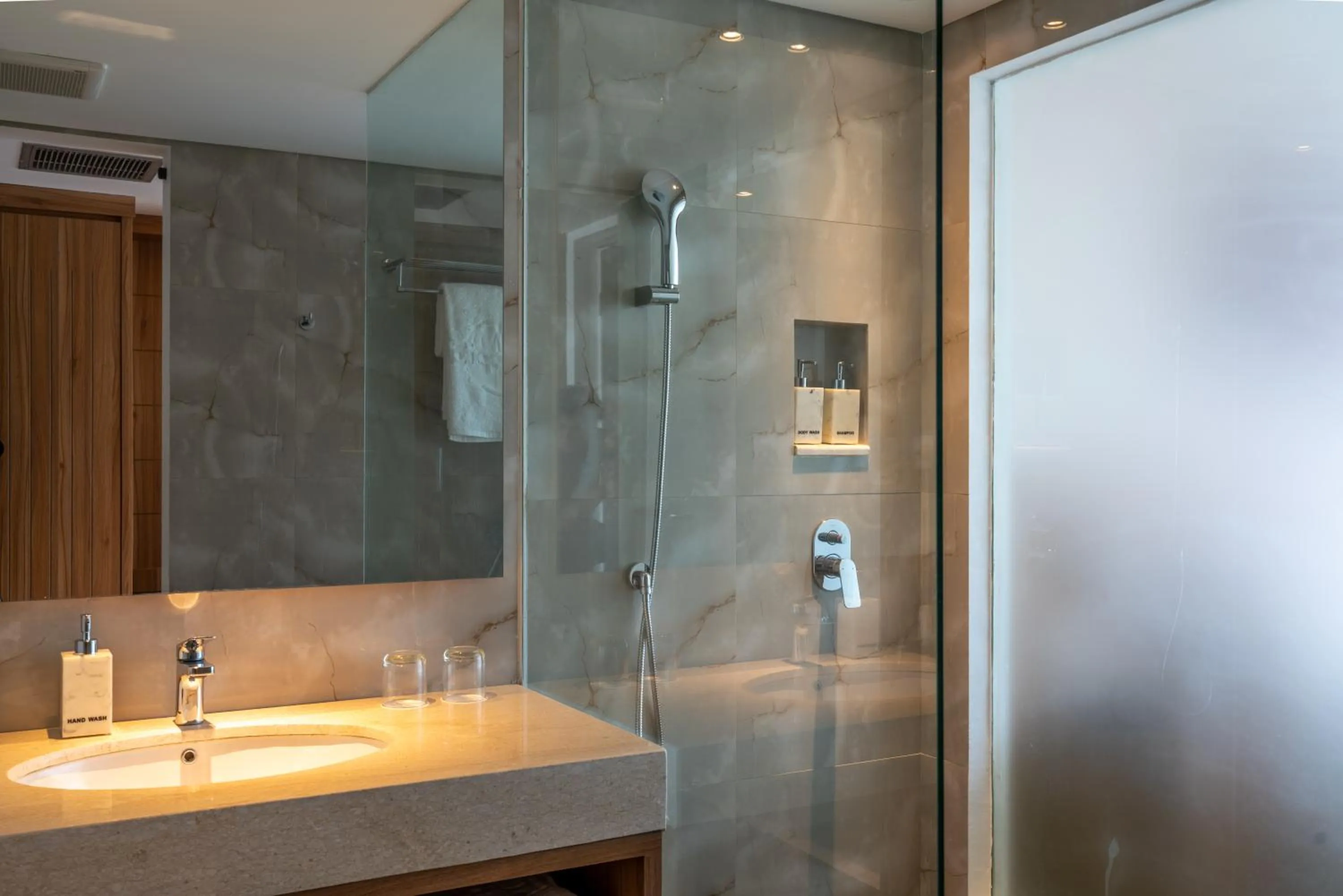 Shower in The Capital Hotel and Resort Seminyak