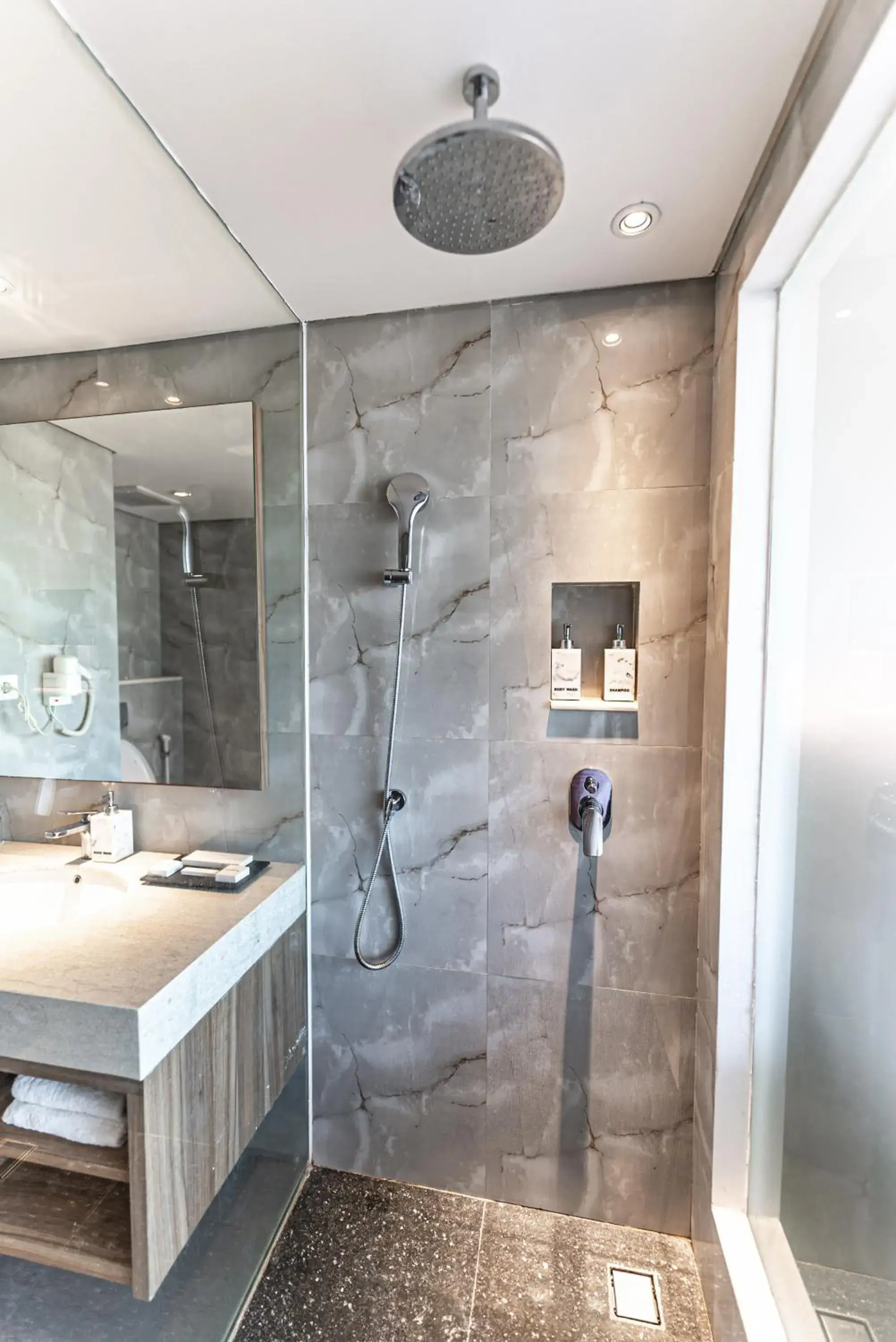 Bathroom in The Capital Hotel and Resort Seminyak Bathroom in The Capital Hotel and Resort Seminyak