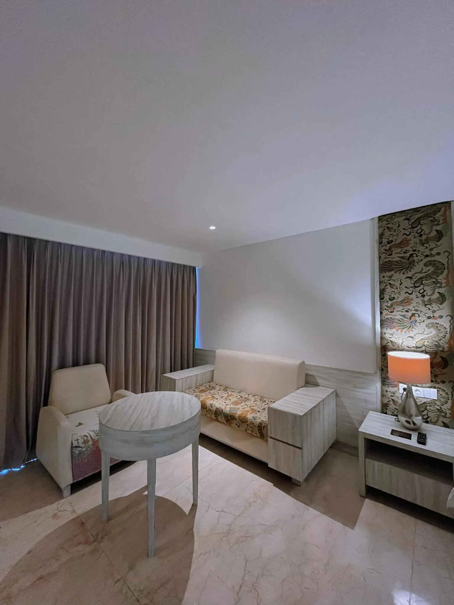 Seating area, Bed in The Capital Hotel and Resort Seminyak