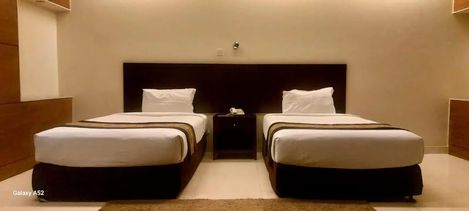 Bed in The Avenue Hotel & Suites Bed in The Avenue Hotel & Suites