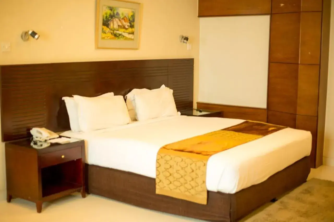 Bed in The Avenue Hotel & Suites Bed in The Avenue Hotel & Suites