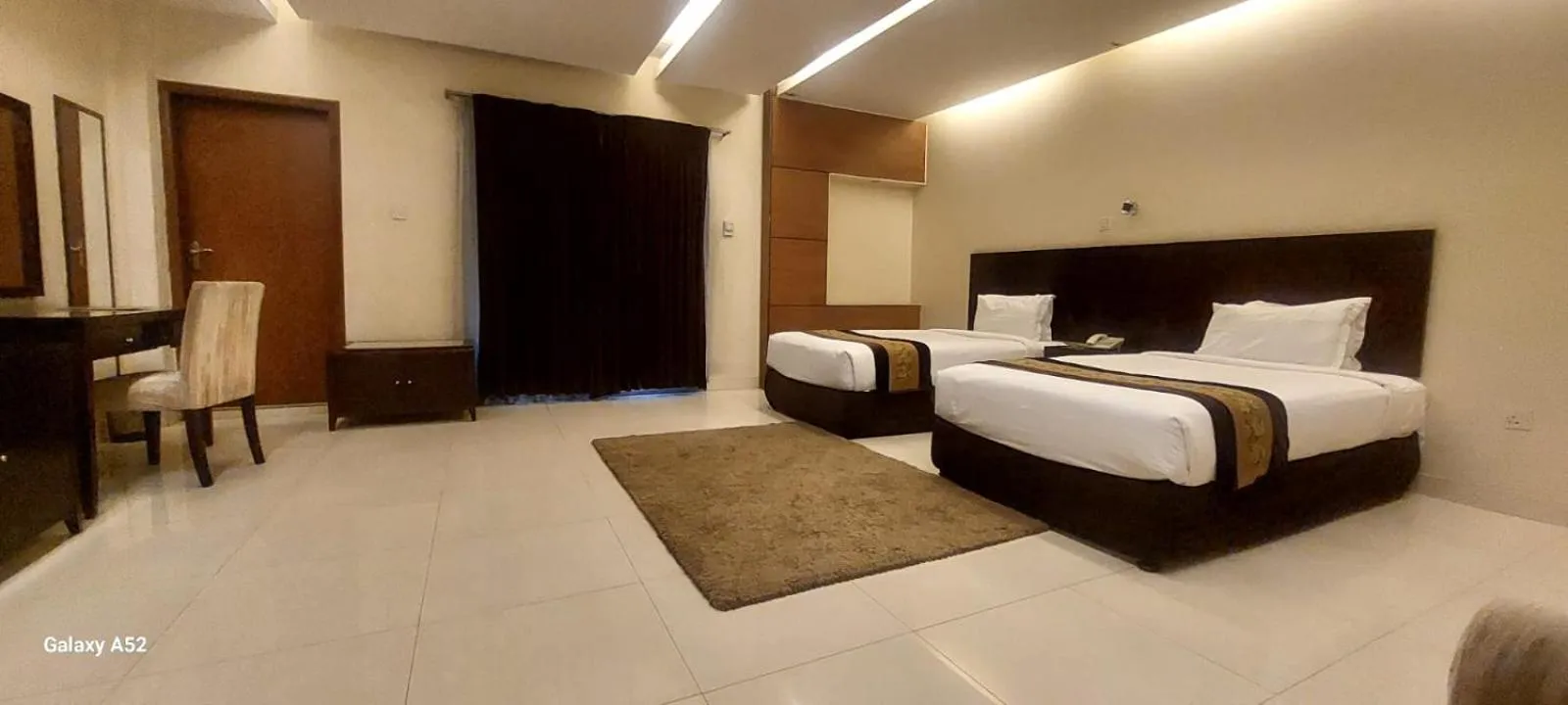 Bed in The Avenue Hotel & Suites