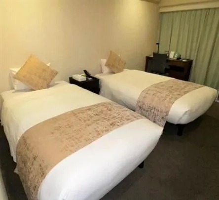 Bed in Roppongi Plaza Hotel