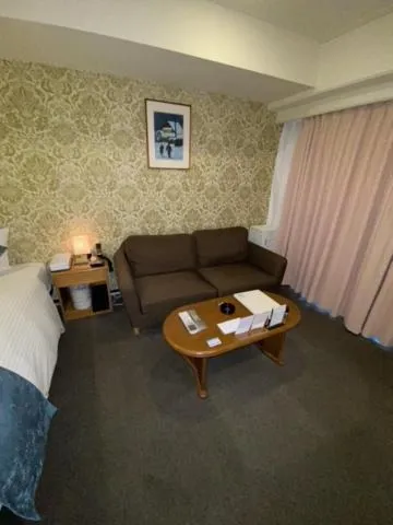 Bed in Roppongi Plaza Hotel