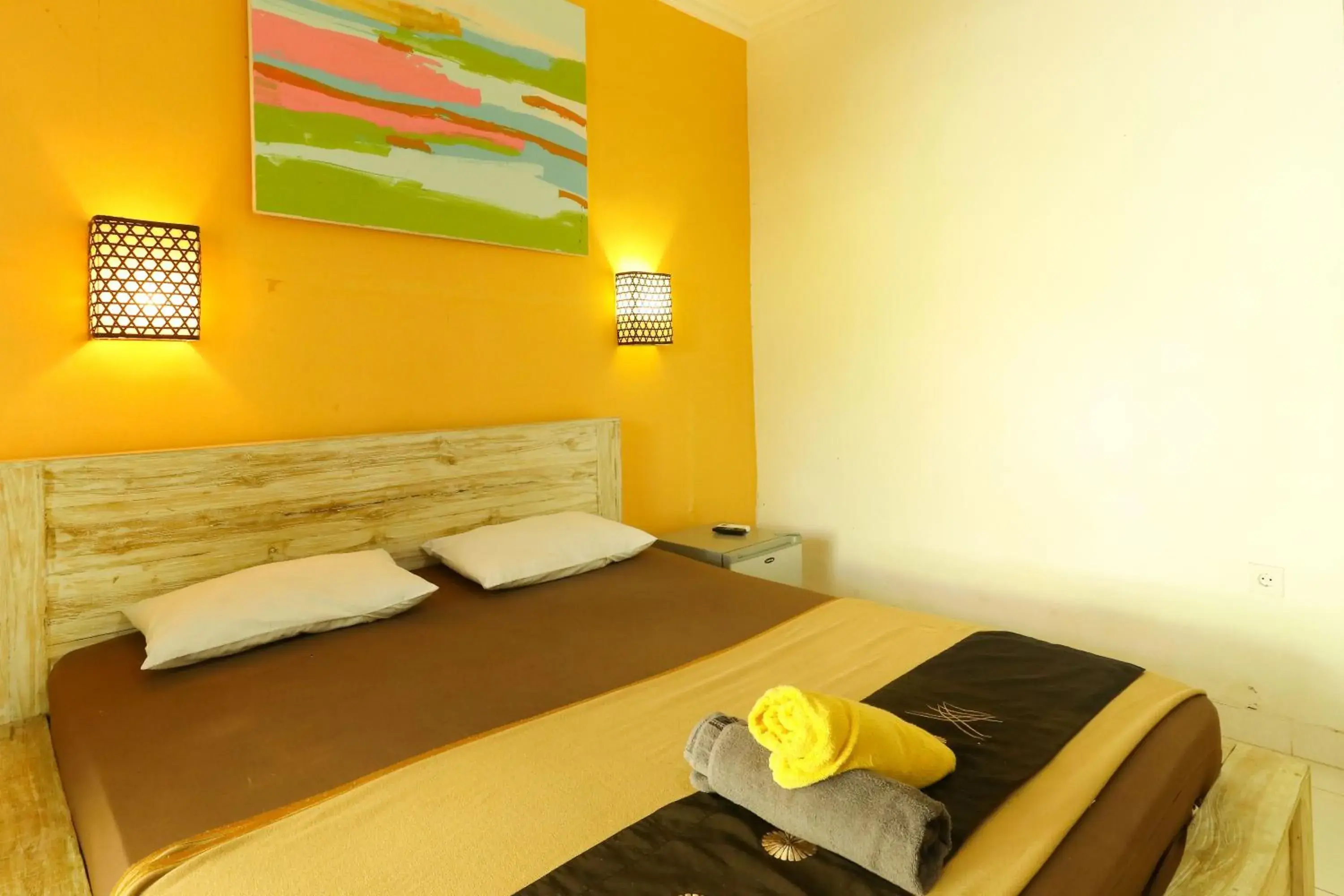 Bed in The Legian Mas Beach Inn Bed in The Legian Mas Beach Inn