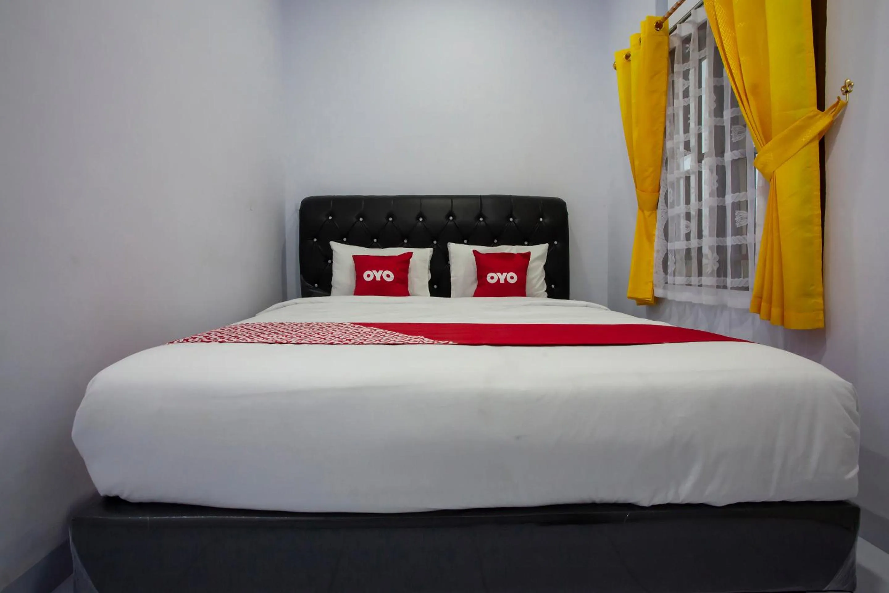 Bedroom in OYO 1764 Sopou Penginapan Rinal & Tuah