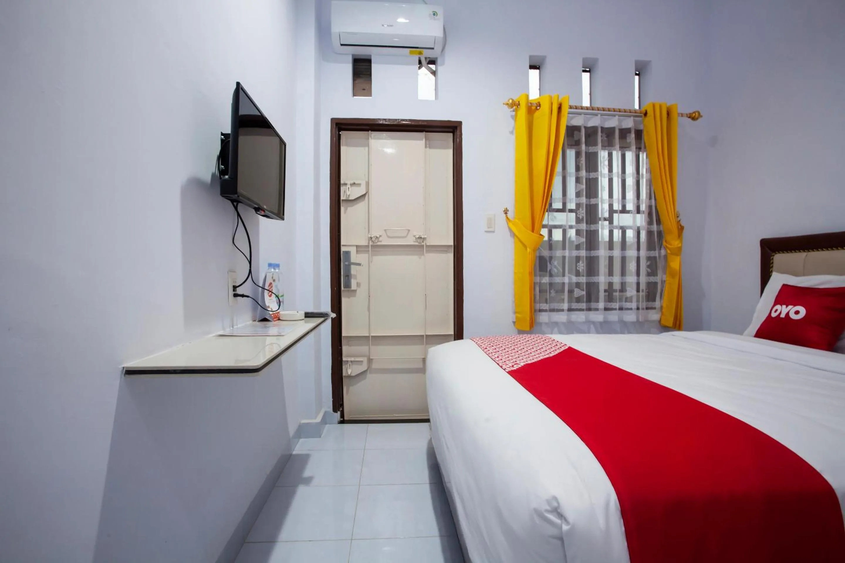 Bedroom in OYO 1764 Sopou Penginapan Rinal & Tuah