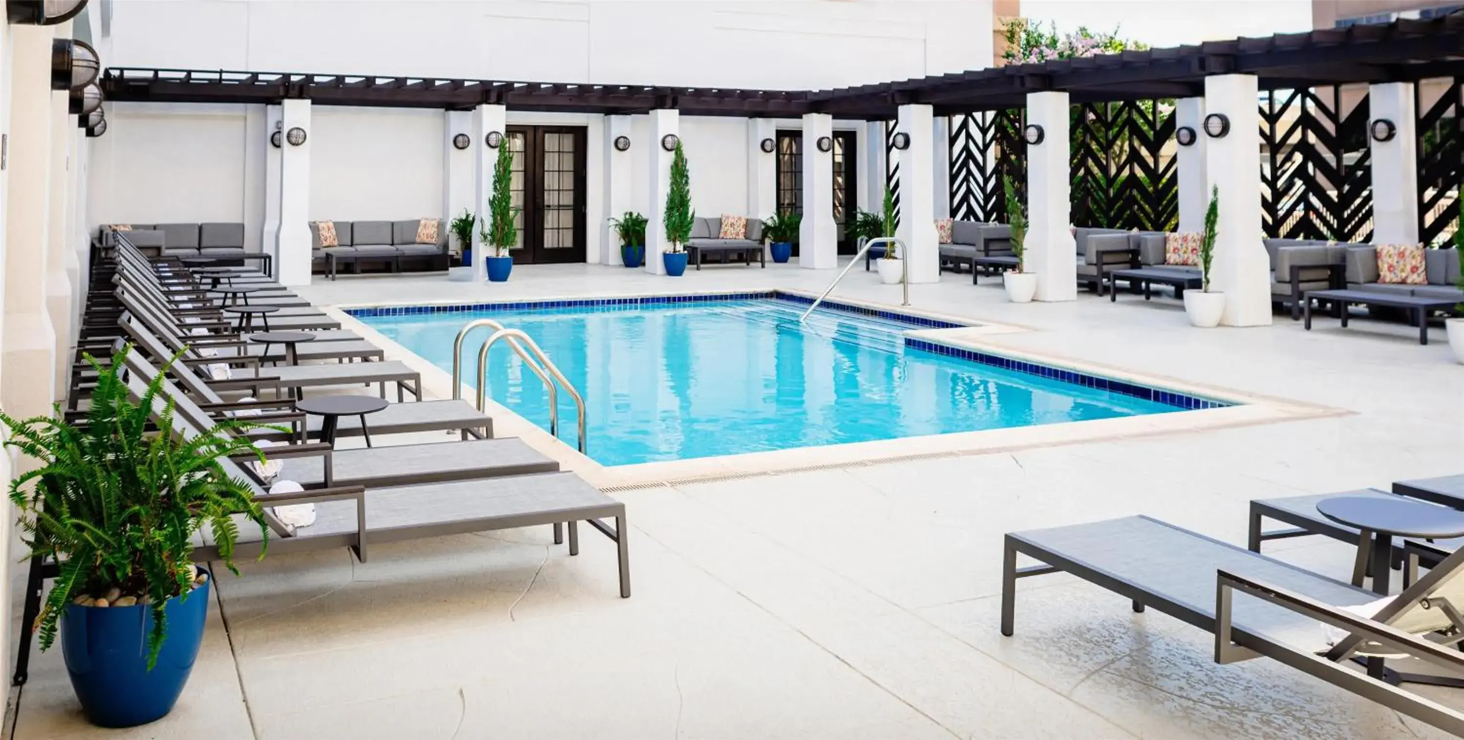 Pool view in The Chifley Houston, Tapestry Collection by Hilton Pool view in The Chifley Houston, Tapestry Collection by Hilton