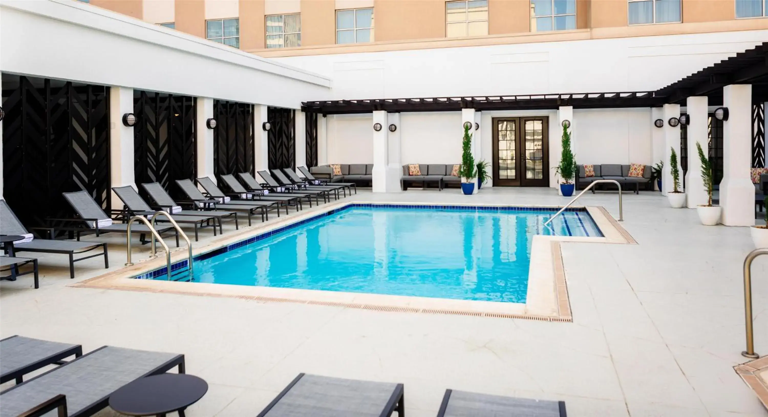 Pool view in The Chifley Houston, Tapestry Collection by Hilton Pool view in The Chifley Houston, Tapestry Collection by Hilton