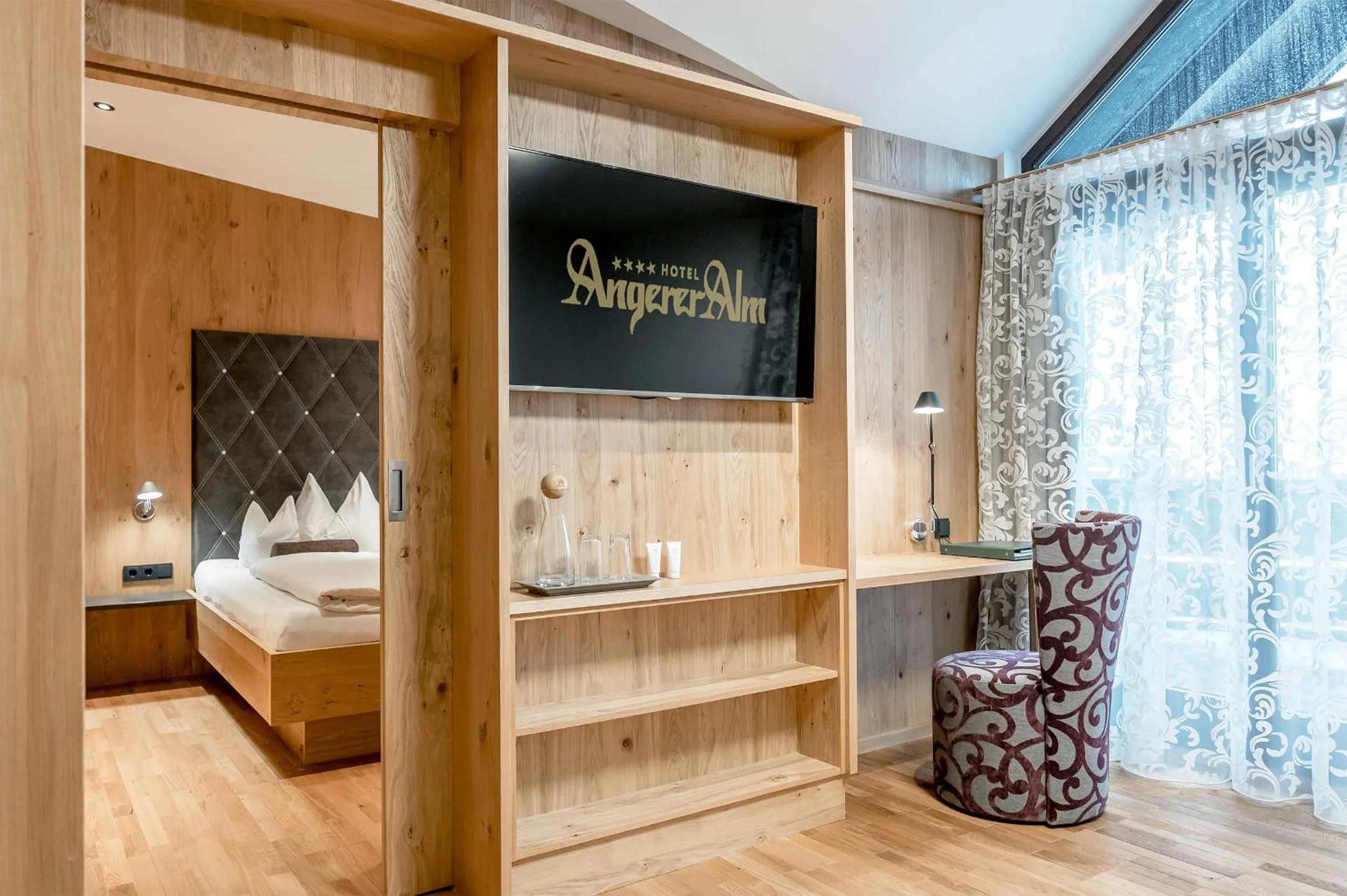 Bed in Hotel Angerer Alm