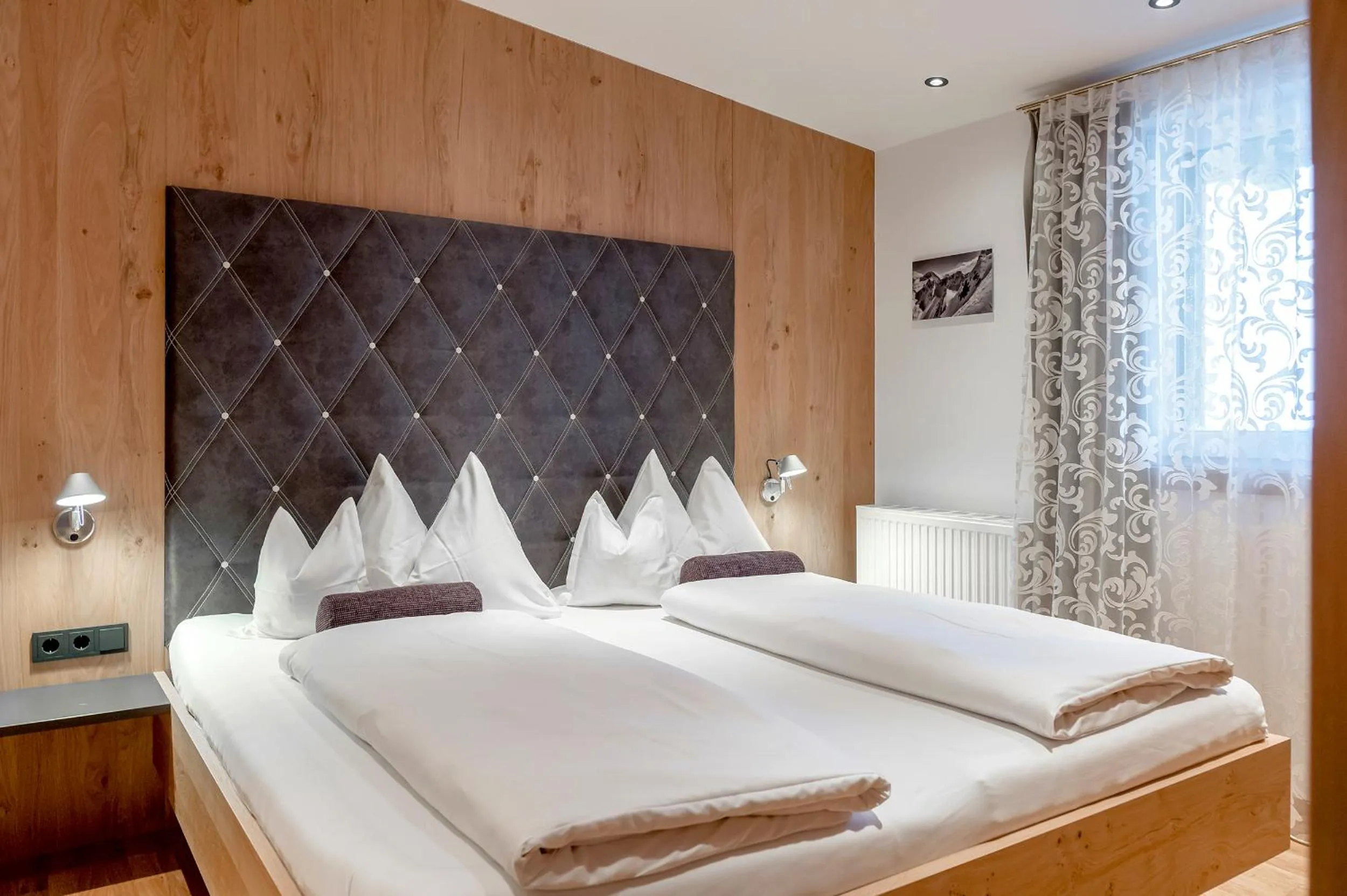 Bed in Hotel Angerer Alm