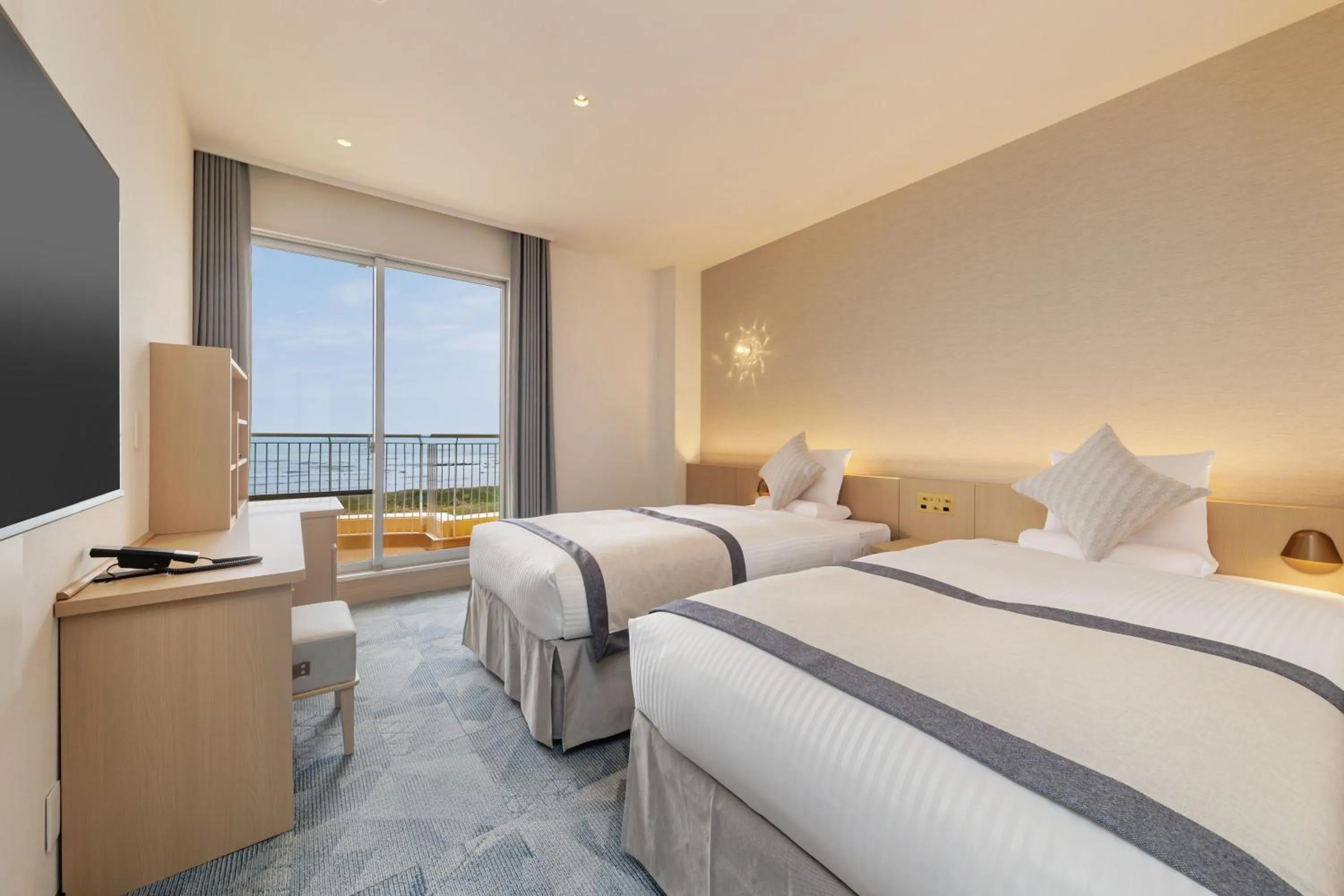 Bed in KAMENOI HOTEL Kujukuri