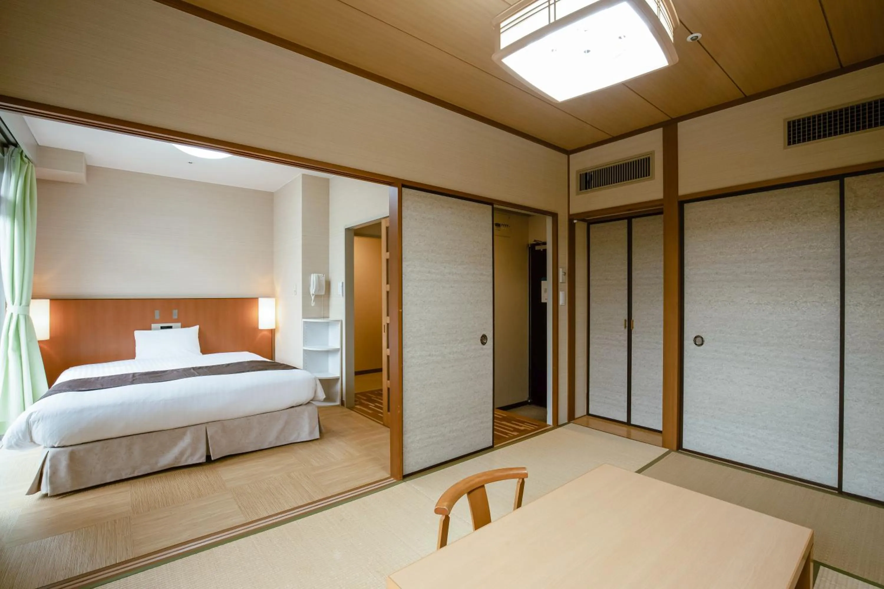 Bed in KAMENOI HOTEL Kanonji