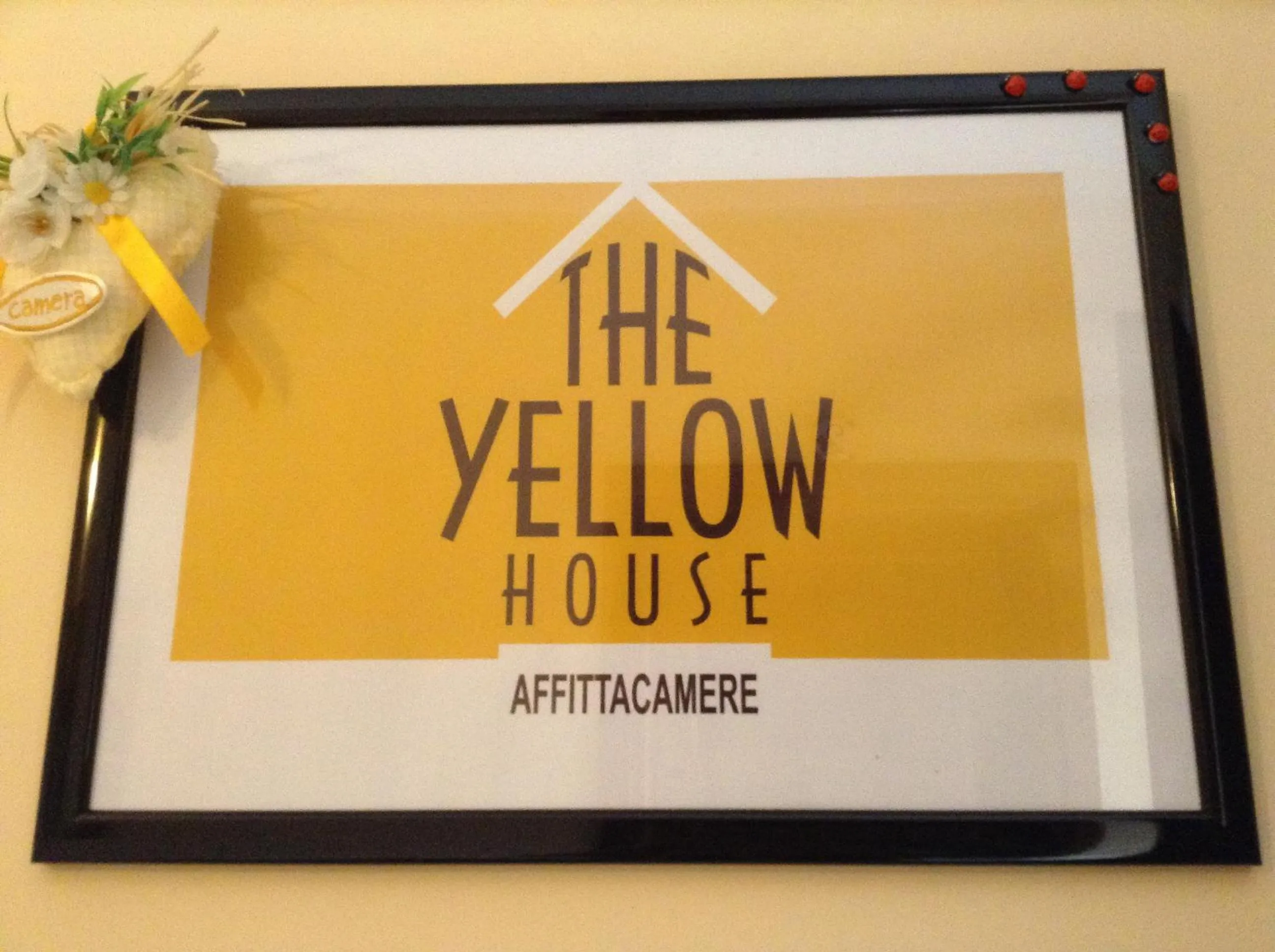 Property logo or sign in The Yellow House